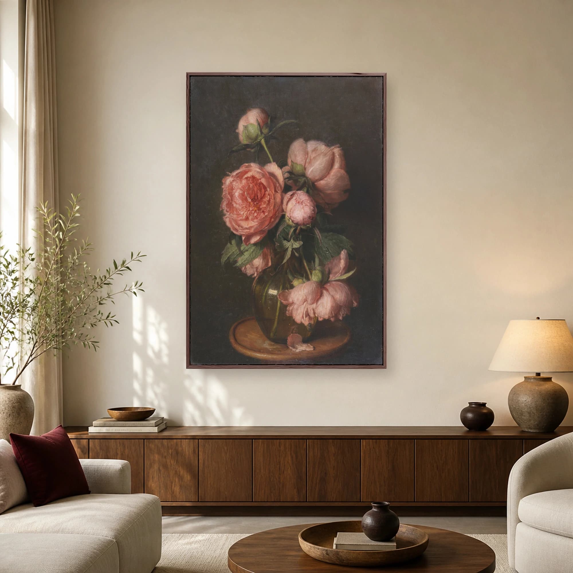A classical oil painting depicting large pink peony flowers and buds in a glass vase against a dark background on a wooden surface.