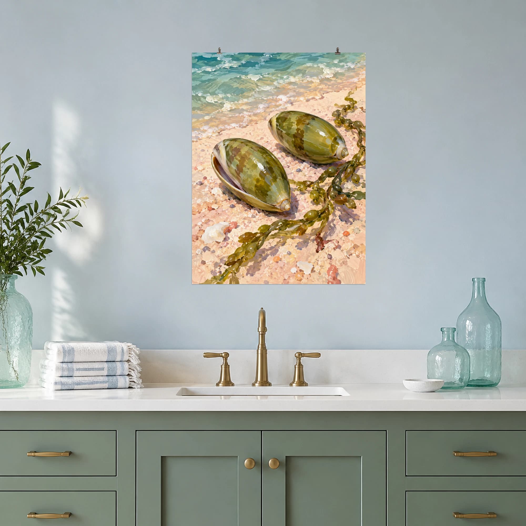 This gouache-style composition features two glossy olive shells resting on pale coral sand beside a delicate seaweed strand. Expressive brushwork and carefully balanced color bring a distinctive focal point to your wall.