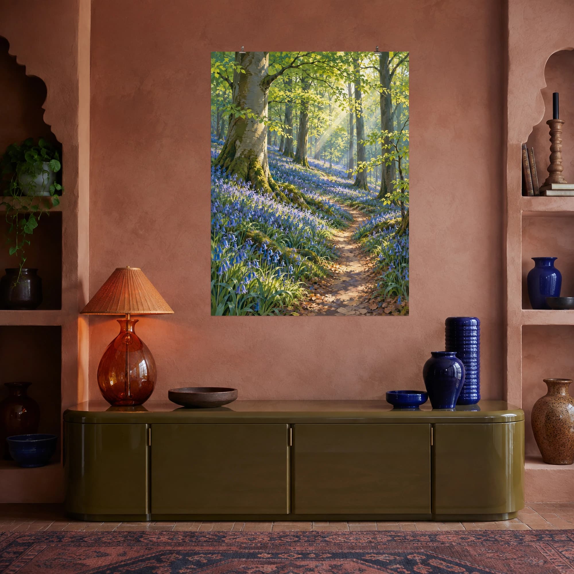 This gouache-style composition features a carpet of bluebells beneath fresh green beech trees with a winding narrow path and shafts of sunlight. Expressive brushwork and carefully balanced color bring a distinctive focal point to your wall.