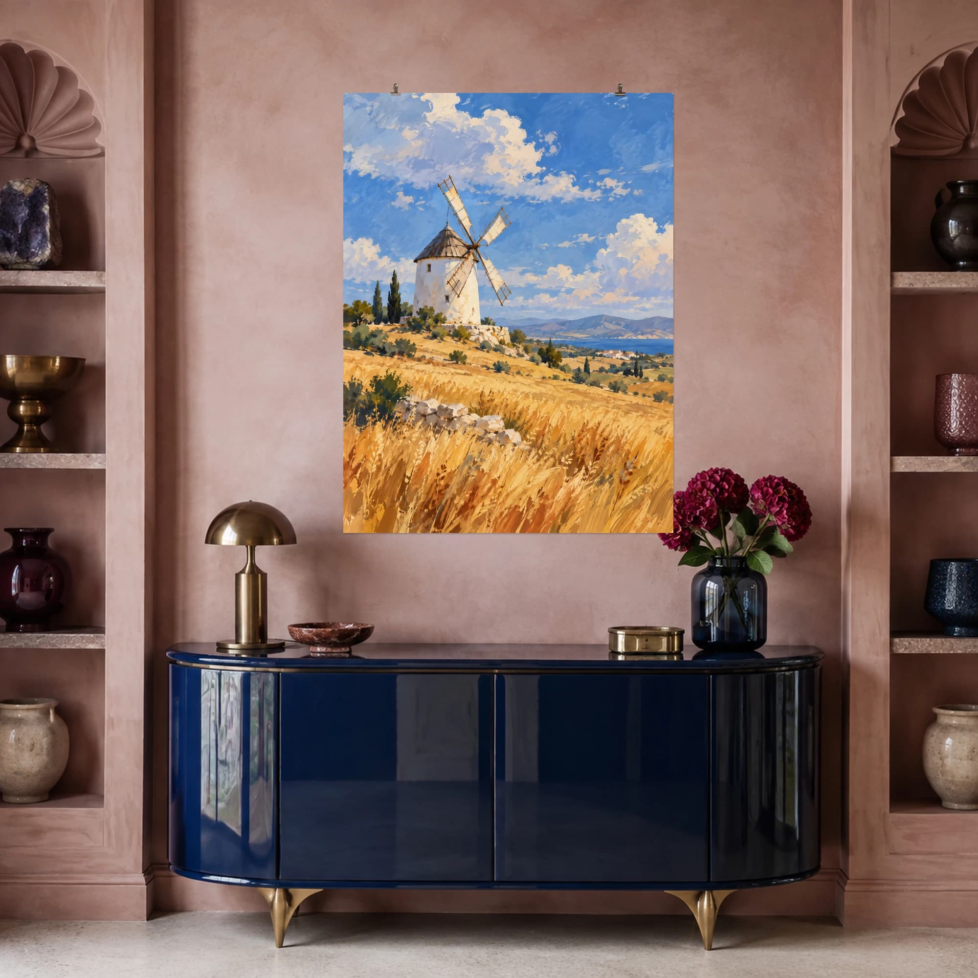 This gouache-style composition features a white windmill above dry golden fields under a wide blue sky with soft clouds. Expressive brushwork and carefully balanced color bring a distinctive focal point to your wall.