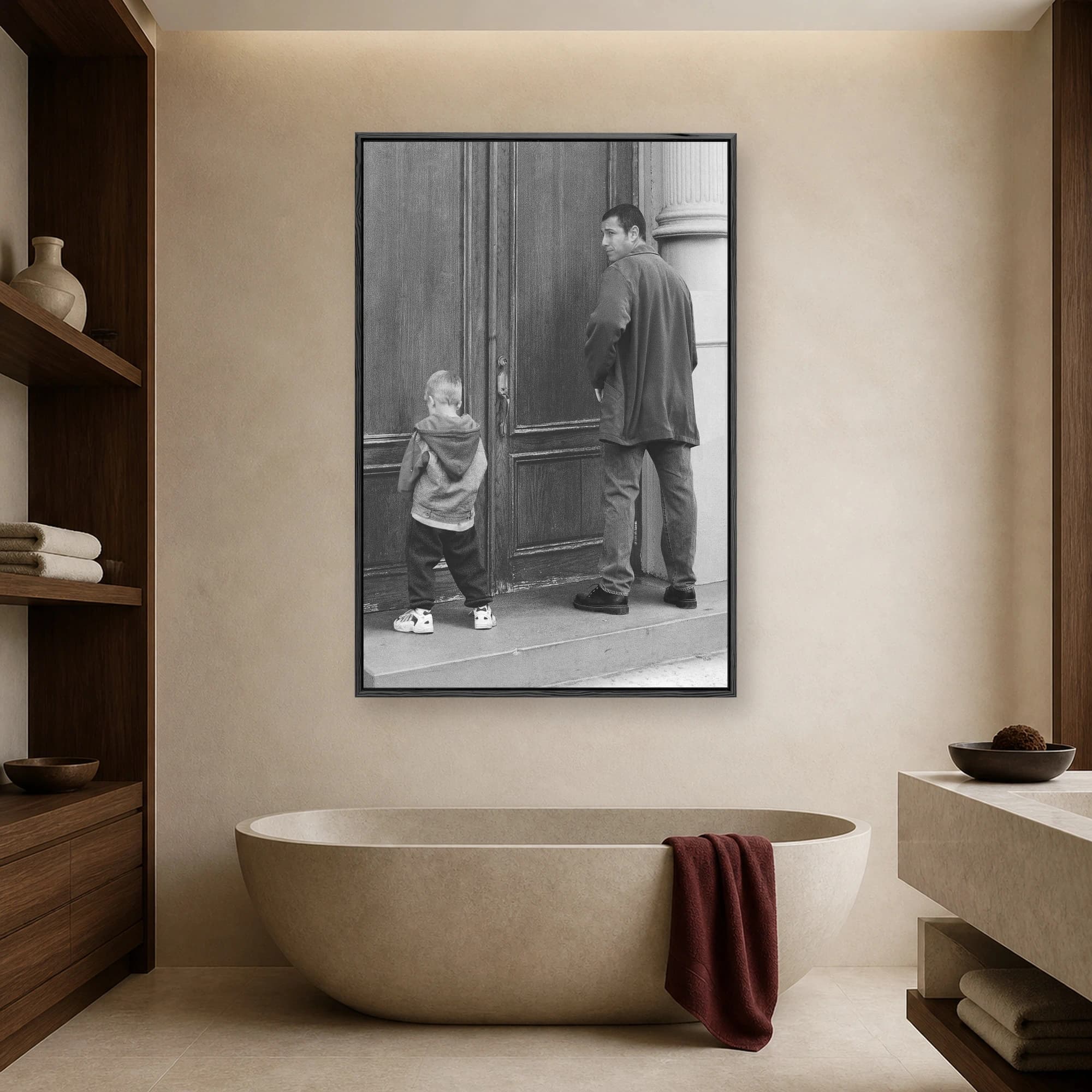 Black and white photograph of an Adam Sandler lookalike standing next to a young child mimicking urinating against large wooden doors