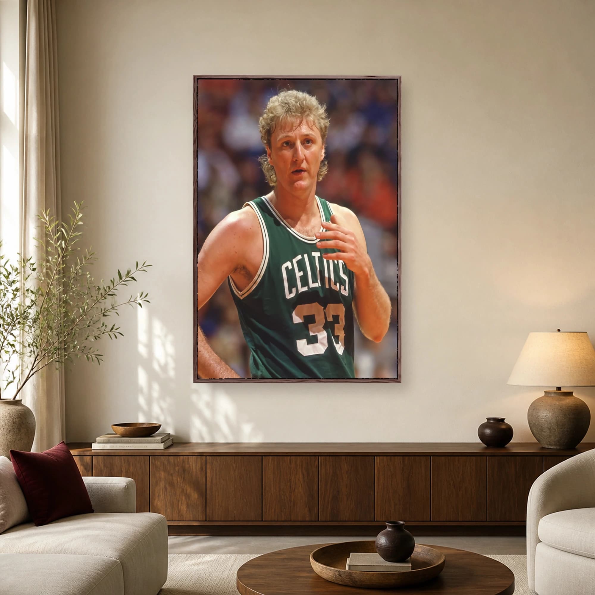 Close‐up portrait of Larry Bird in his green Boston Celtics number 33 jersey with an intense, focused expression.
