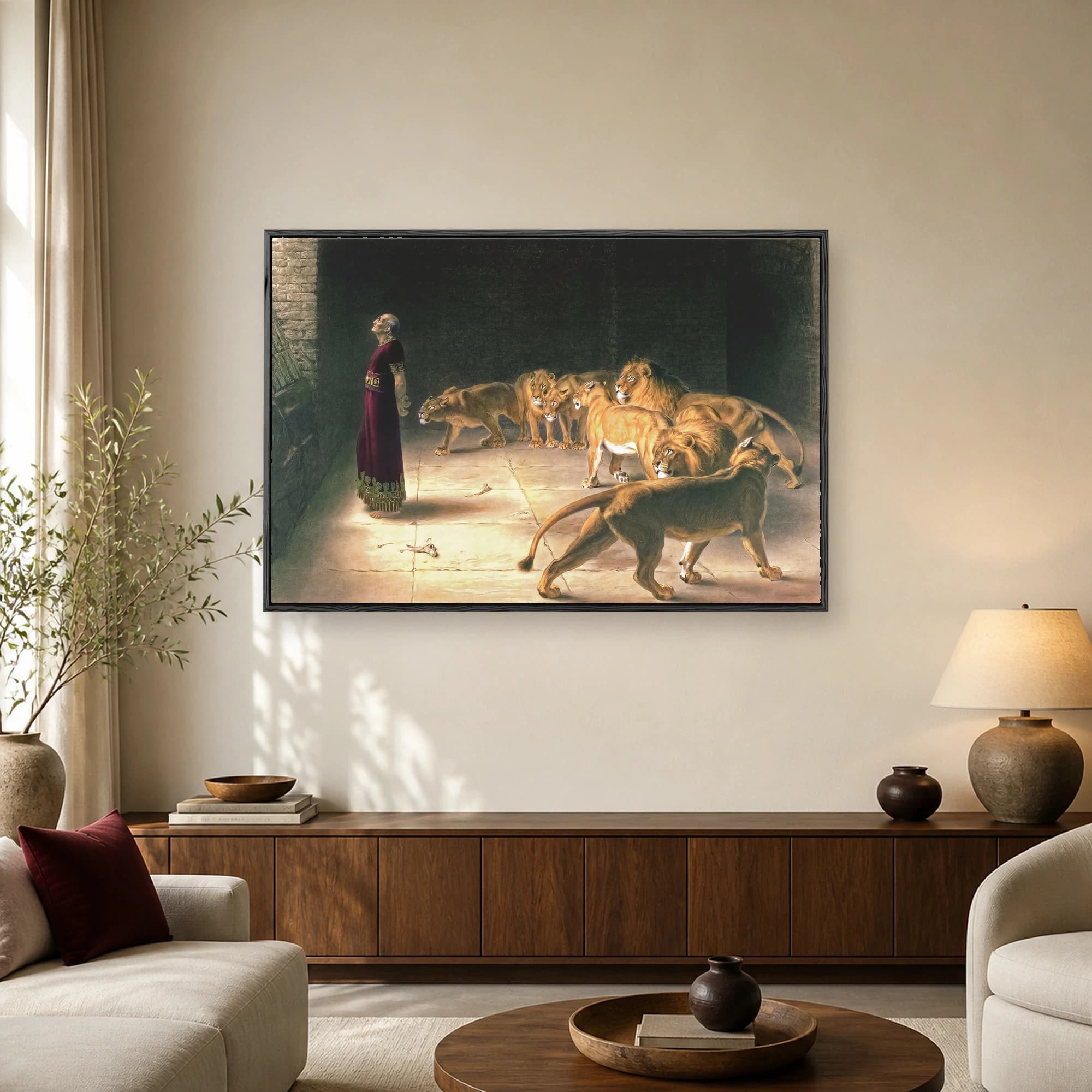 Fine art print of Daniel standing calmly in a dark stone den surrounded by prowling lions under a shaft of golden light.
