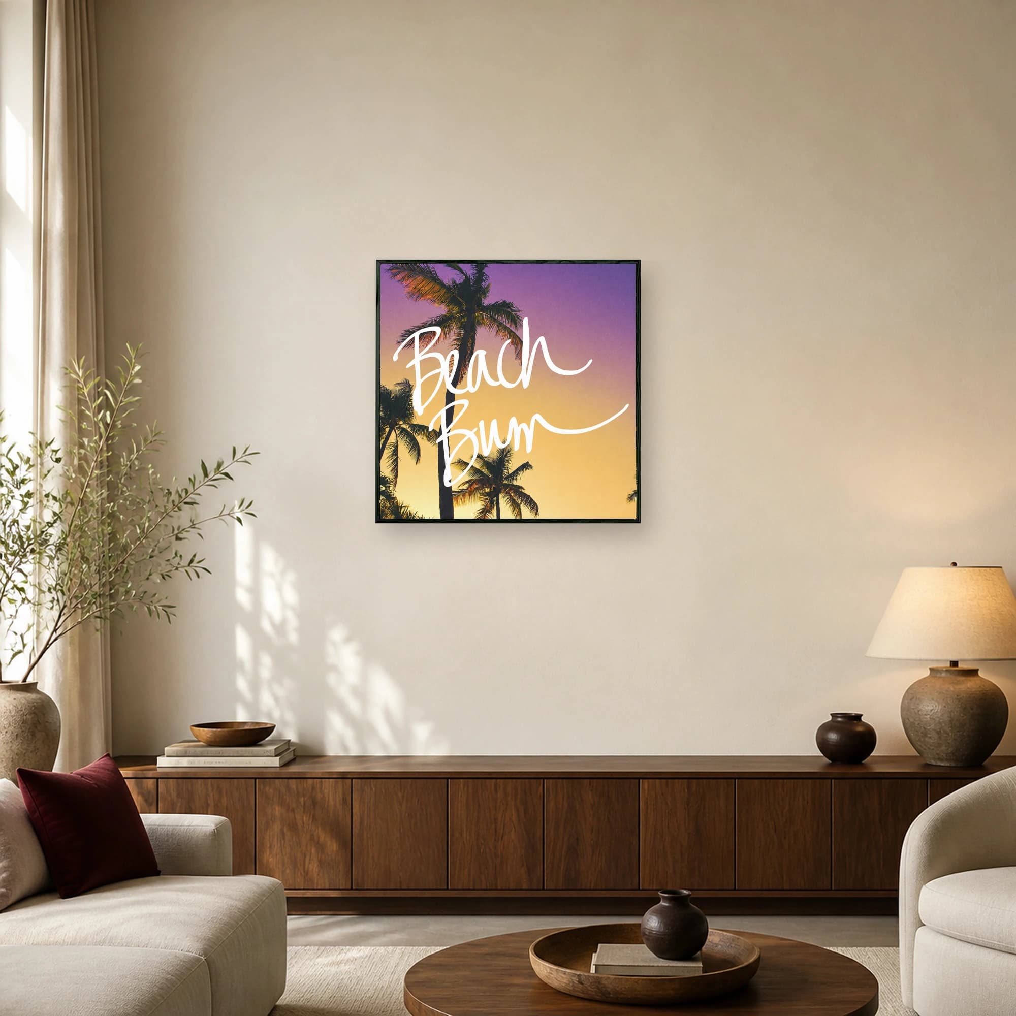 Silhouetted palm trees against a purple and orange sunset sky with white hand-lettered text reading Beach Bum.