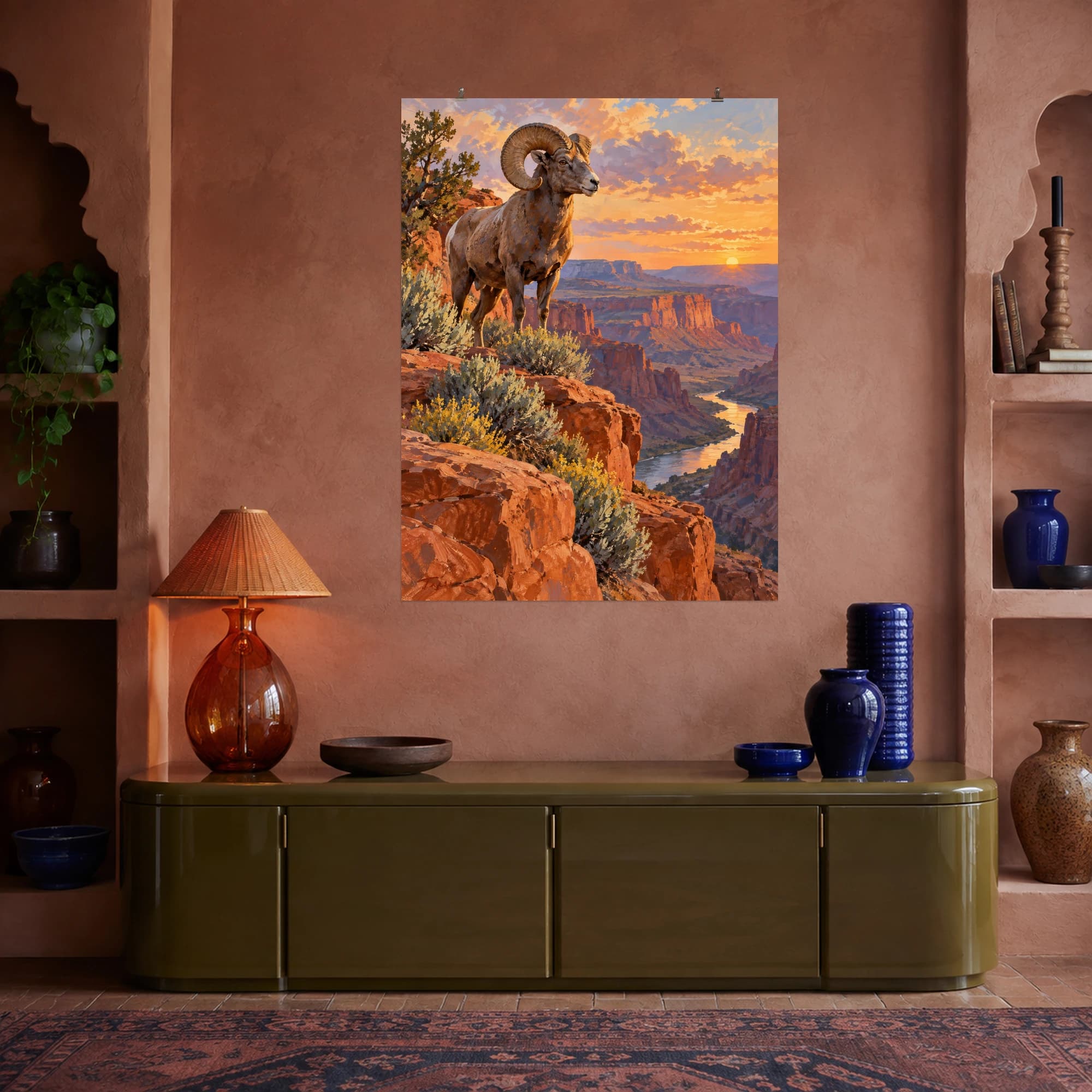 This gouache-style composition features a bighorn sheep standing on a red canyon ledge with desert sage and warm evening light. Expressive brushwork and carefully balanced color bring a distinctive focal point to your wall.