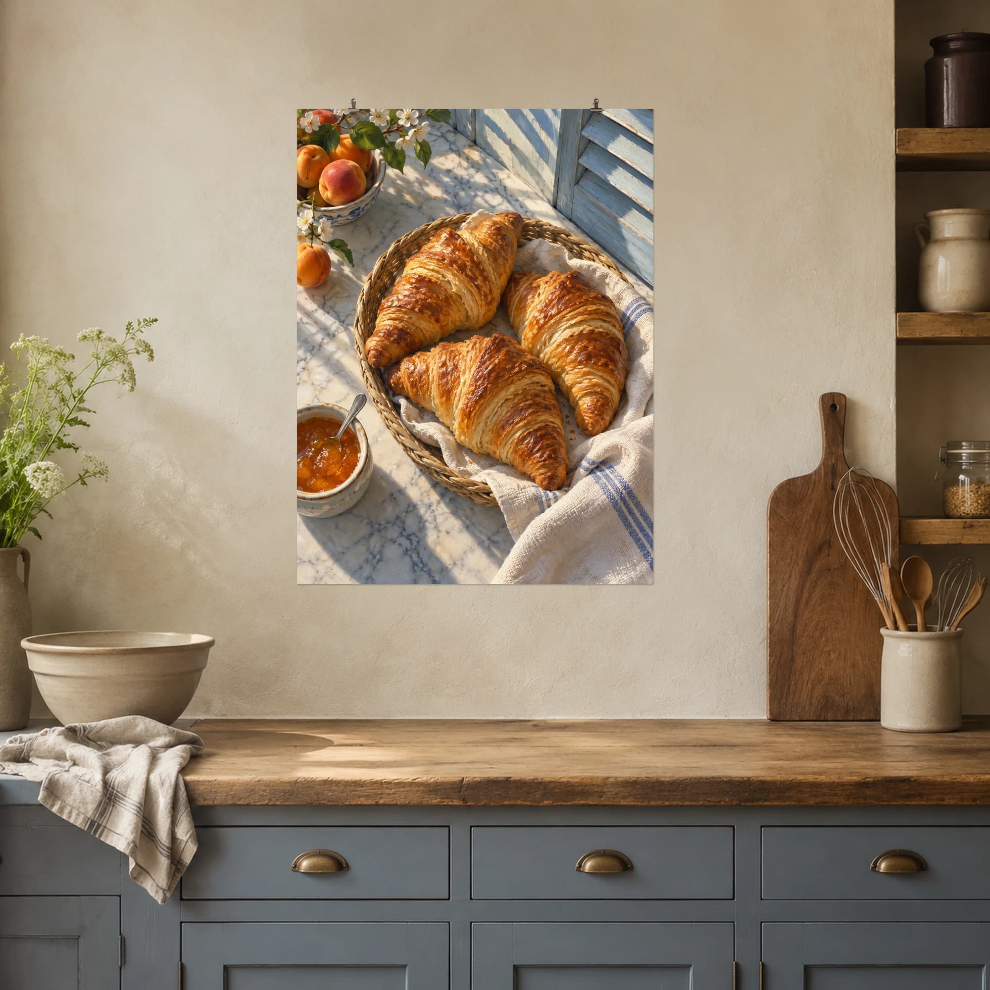 Golden croissants fill a wicker basket beside apricot jam on a sunlit marble counter.