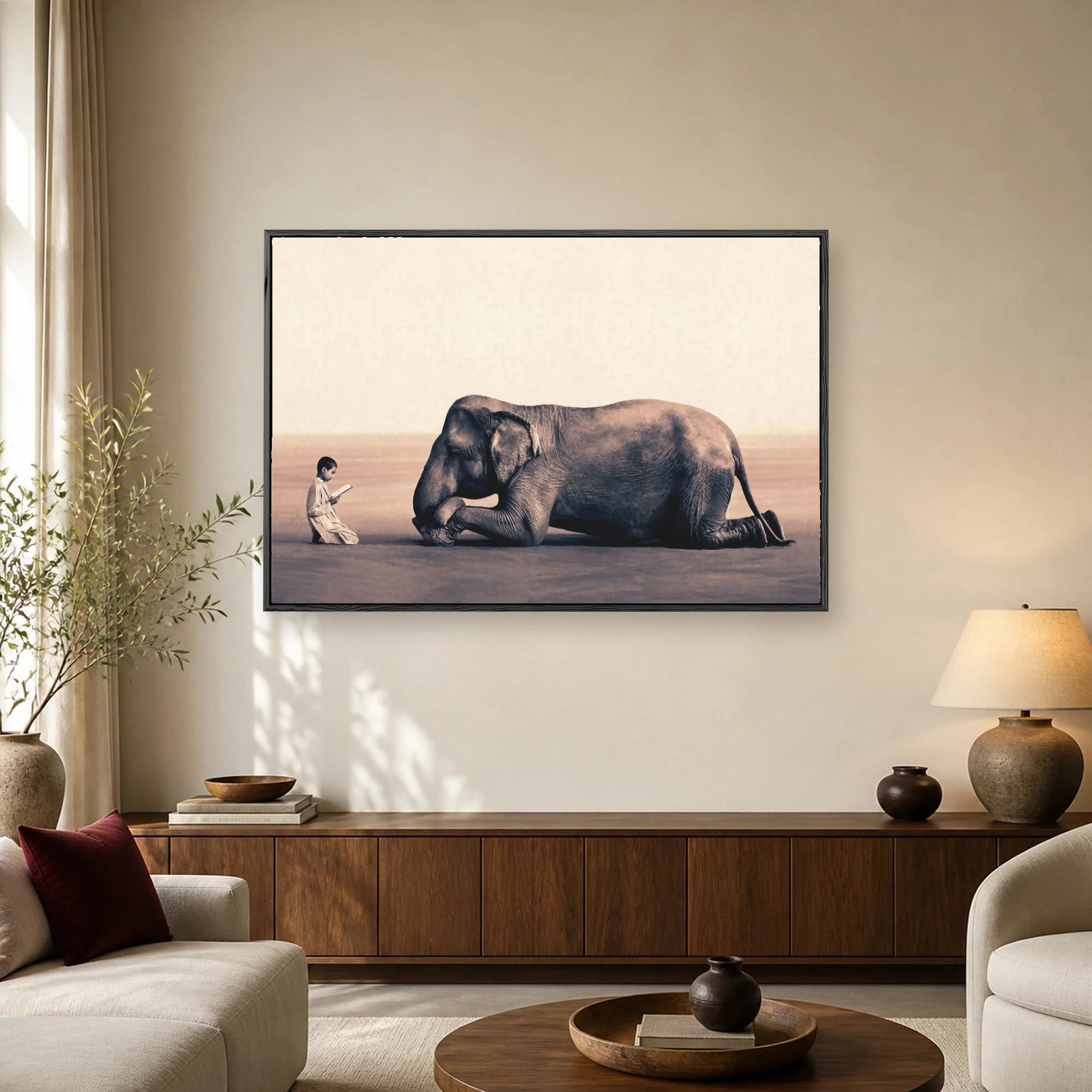 Surreal sepia art print showing a young boy in a tunic reading an open book to a large elephant kneeling on a vast plain.