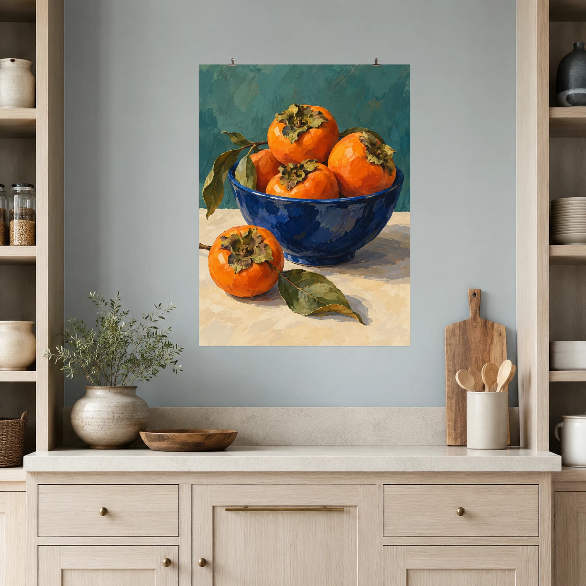 Orange persimmons fill a cobalt bowl against a muted teal backdrop. Cream tones and broad brushwork balance the vivid fruit in this inviting kitchen still life.