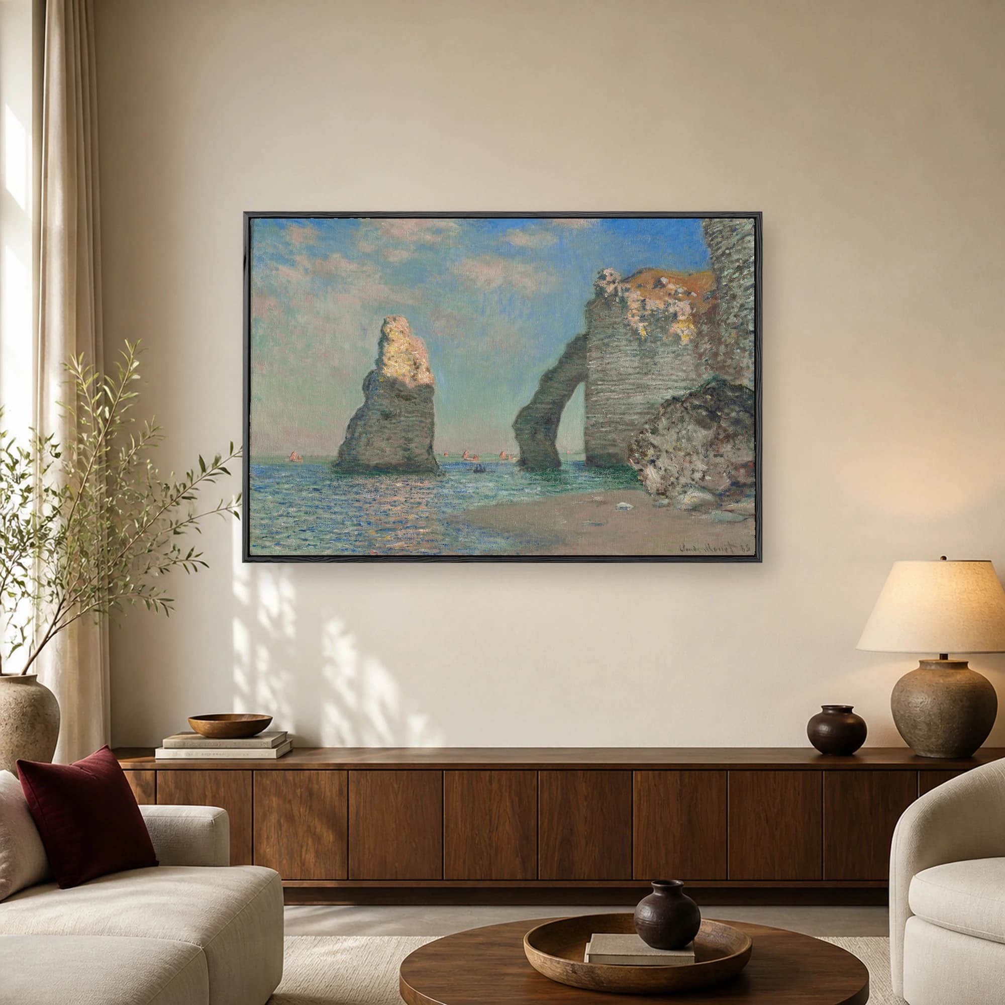 Impressionist painting of coastal cliffs and a natural rock arch over a blue sea with distant sailboats by Claude Monet