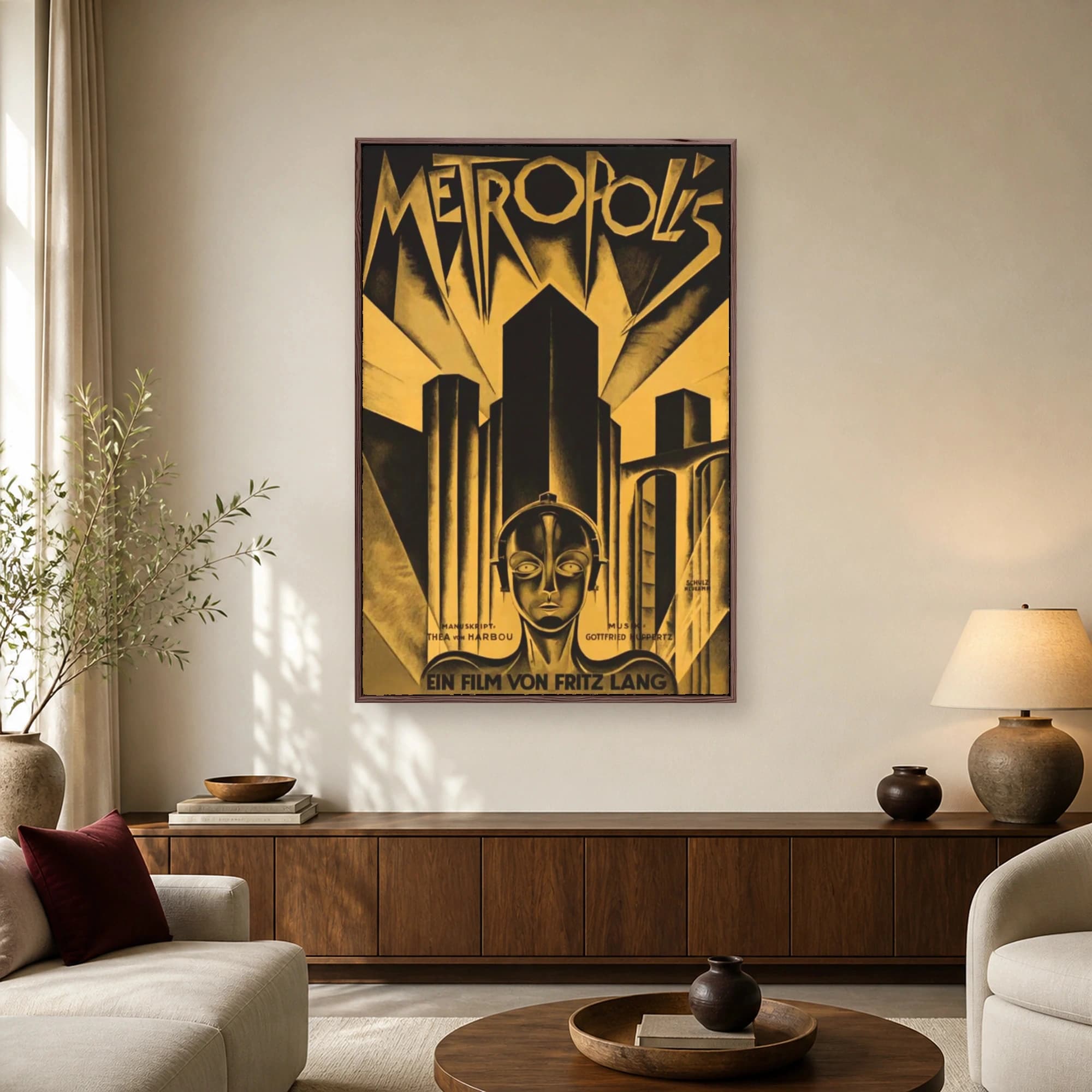 Vintage Metropolis movie poster featuring the iconic robot head below towering skyscrapers in striking gold and black Art Deco style.