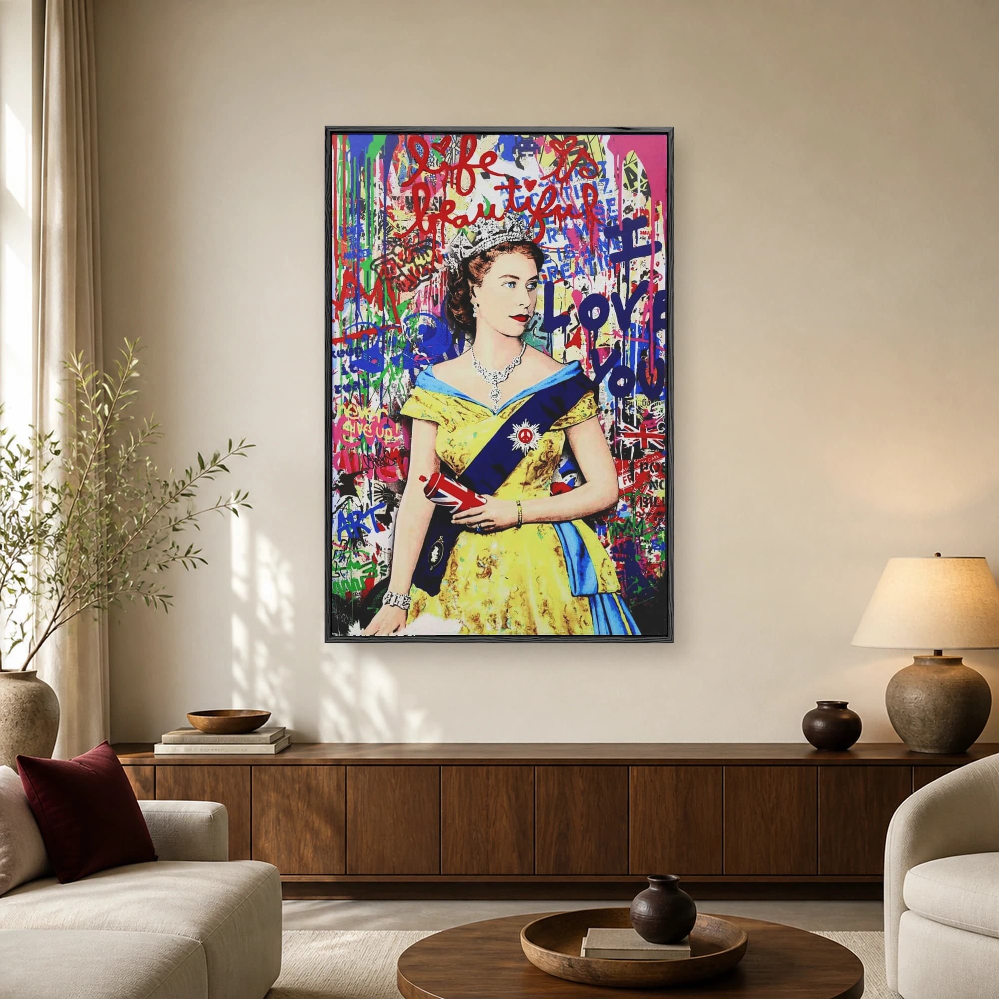 Pop art print of Queen Elizabeth II against a colorful graffiti wall holding a spray paint can with a Union Jack design.