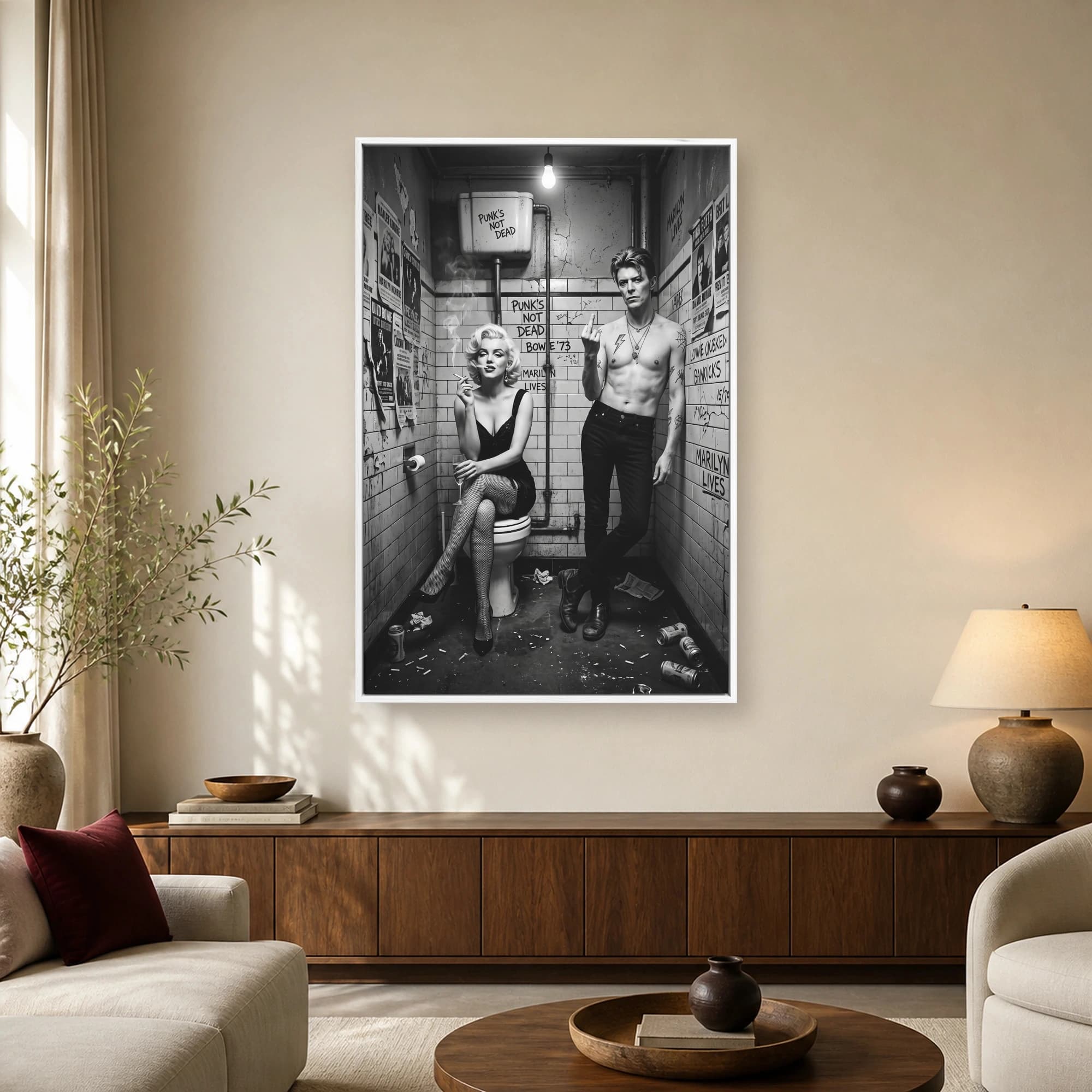 Black and white artwork of Marilyn Monroe smoking on a toilet next to a shirtless David Bowie flashing a middle finger in a graffiti-covered restroom
