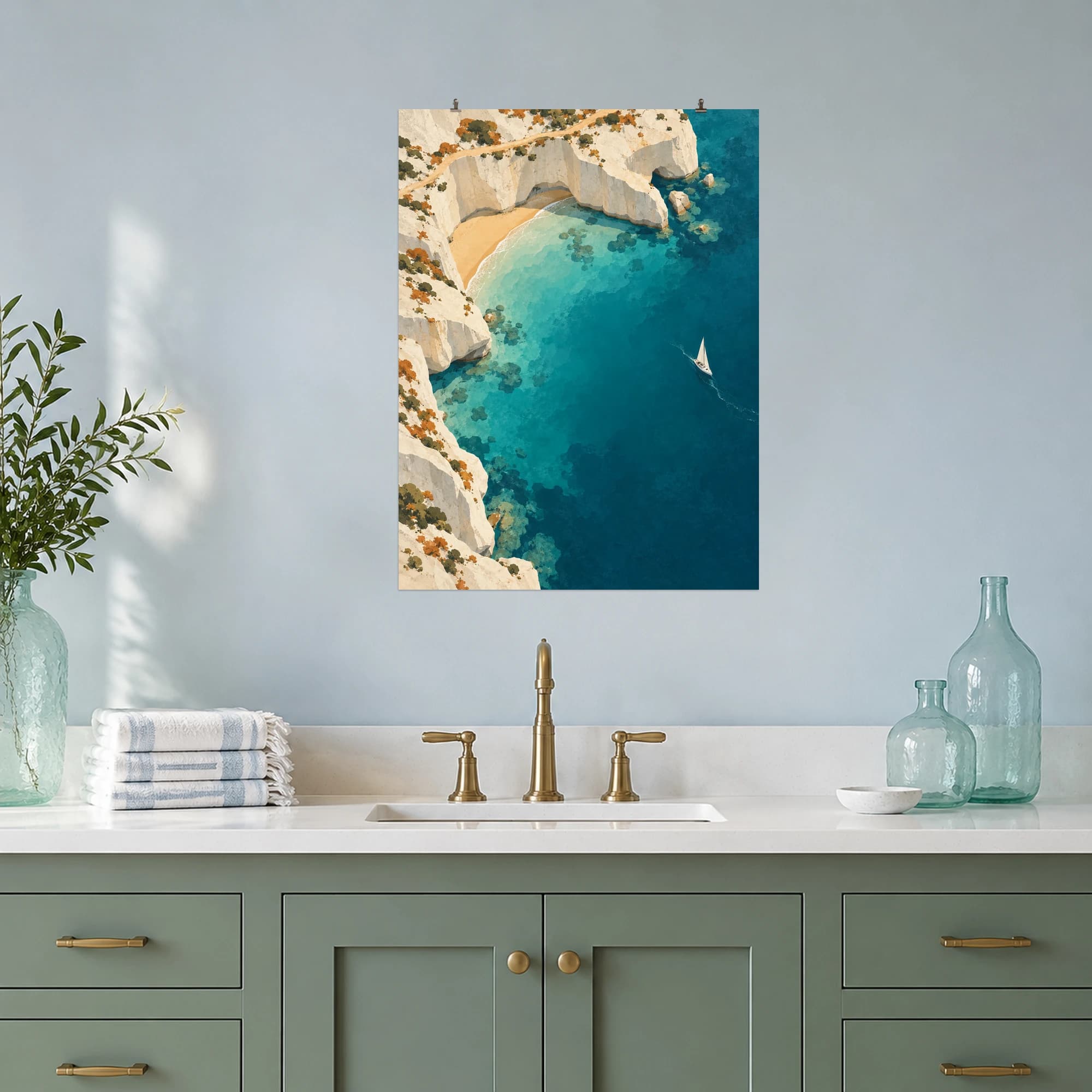 An overhead coastal scene pairs pale limestone cliffs, an ochre path and turquoise water with a tiny white sailboat.