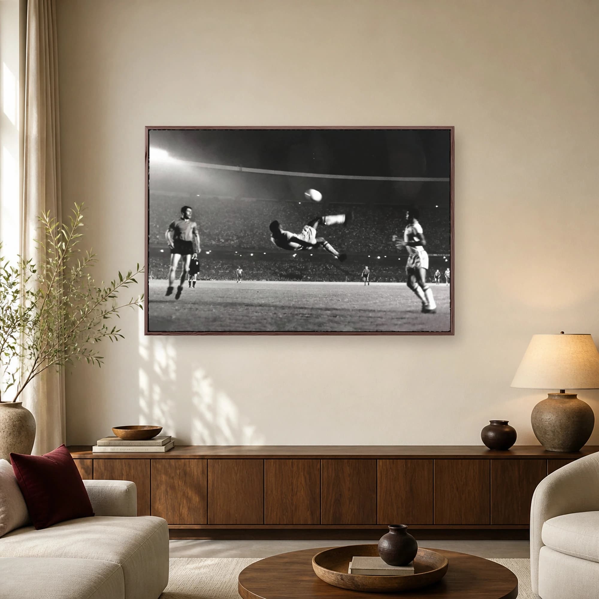 Black and white historic photograph of a soccer legend performing an acrobatic bicycle kick in a packed stadium.