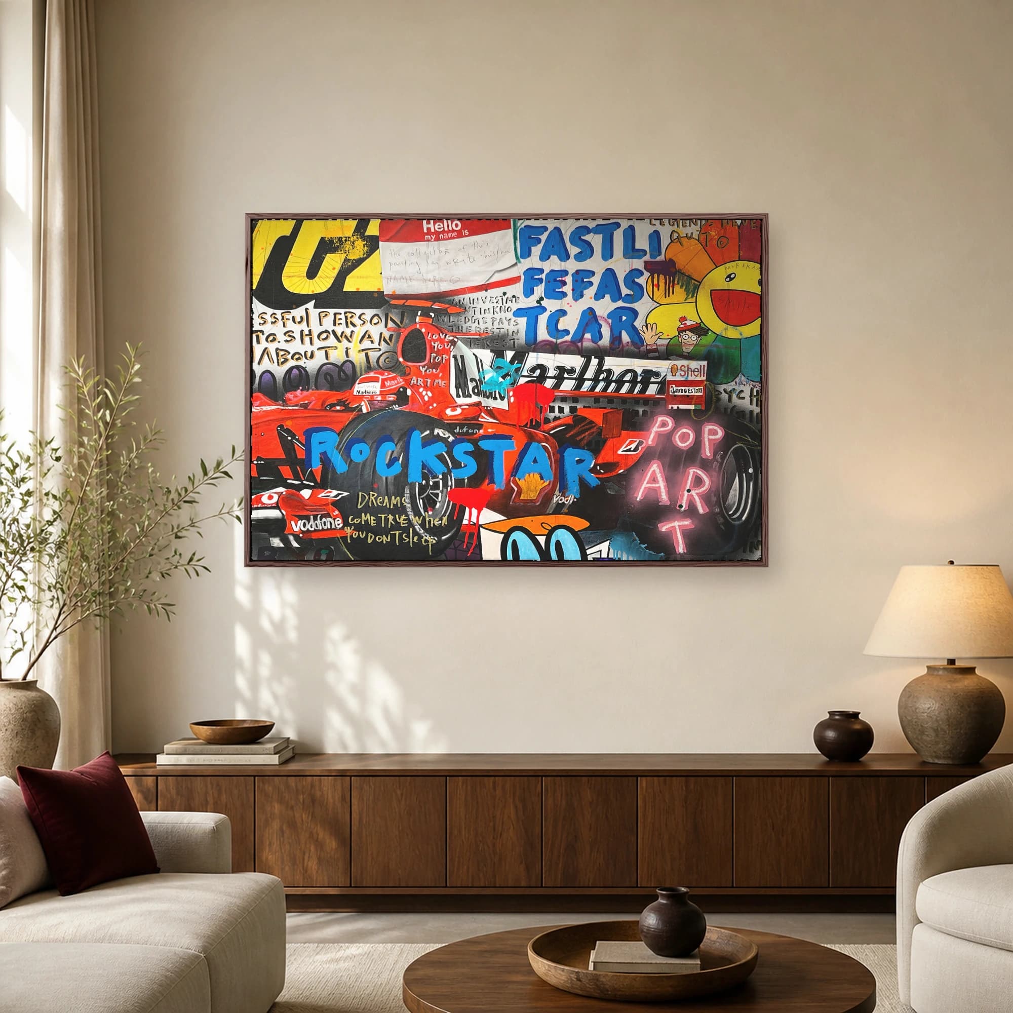 A vibrant mixed media pop art wall piece featuring a red Formula One racing car, bold blue typography, and graffiti elements.