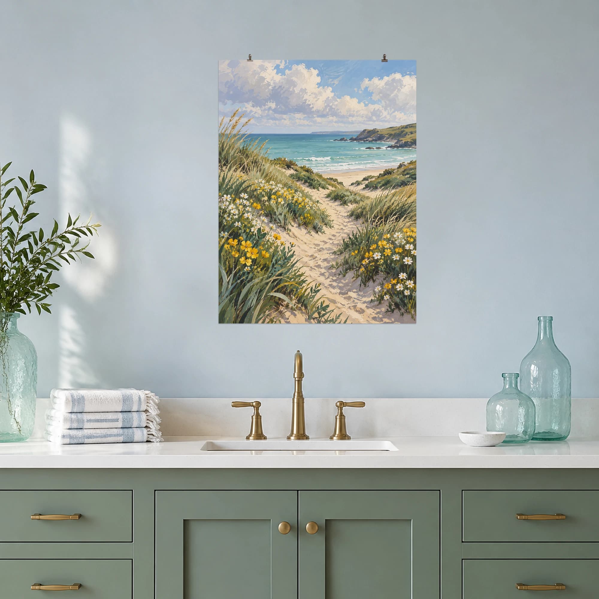 A sandy path winds through wildflowers toward a pale turquoise sea.
