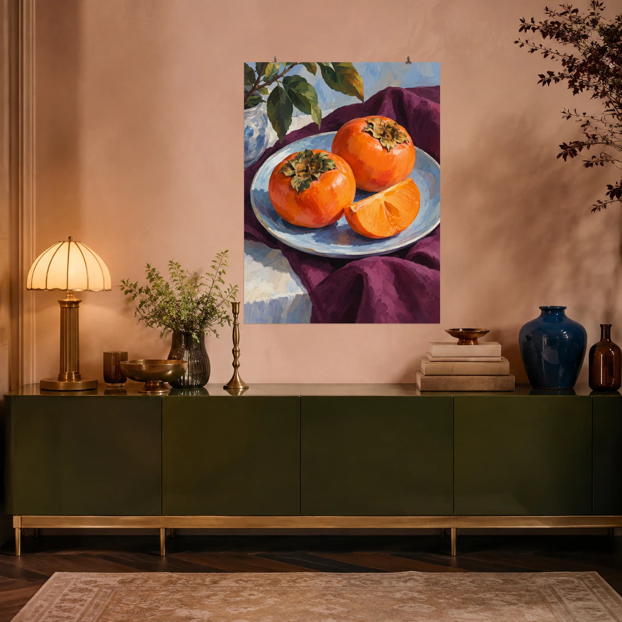 This gouache-style composition features two ripe orange persimmons and one sliced fruit on a pale blue dish with a plum napkin. Expressive brushwork and carefully balanced color bring a distinctive focal point to your wall.