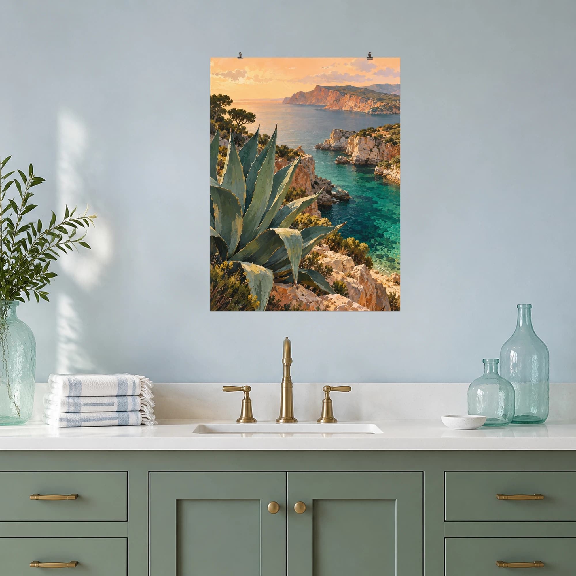 This gouache-style composition features sculptural agave leaves above a sandstone coastal inlet with emerald water, distant terracotta headland and a pale apricot sky. Expressive brushwork and a balanced palette bring warmth and character to your space.