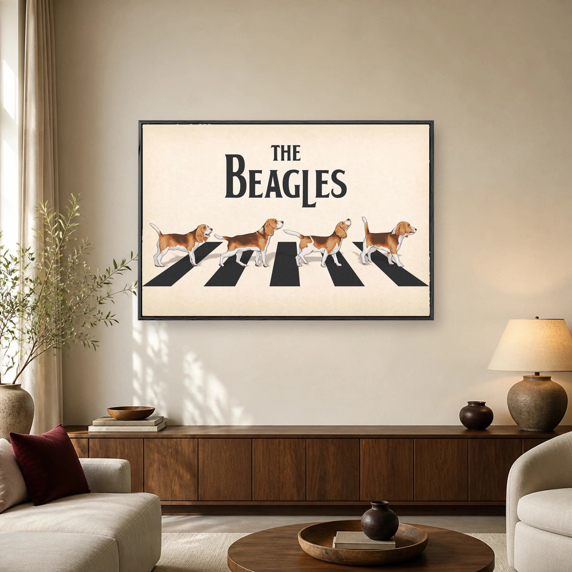 Illustration of four beagles walking across a zebra crossing in a parody of Abbey Road with the text The Beagles above them.