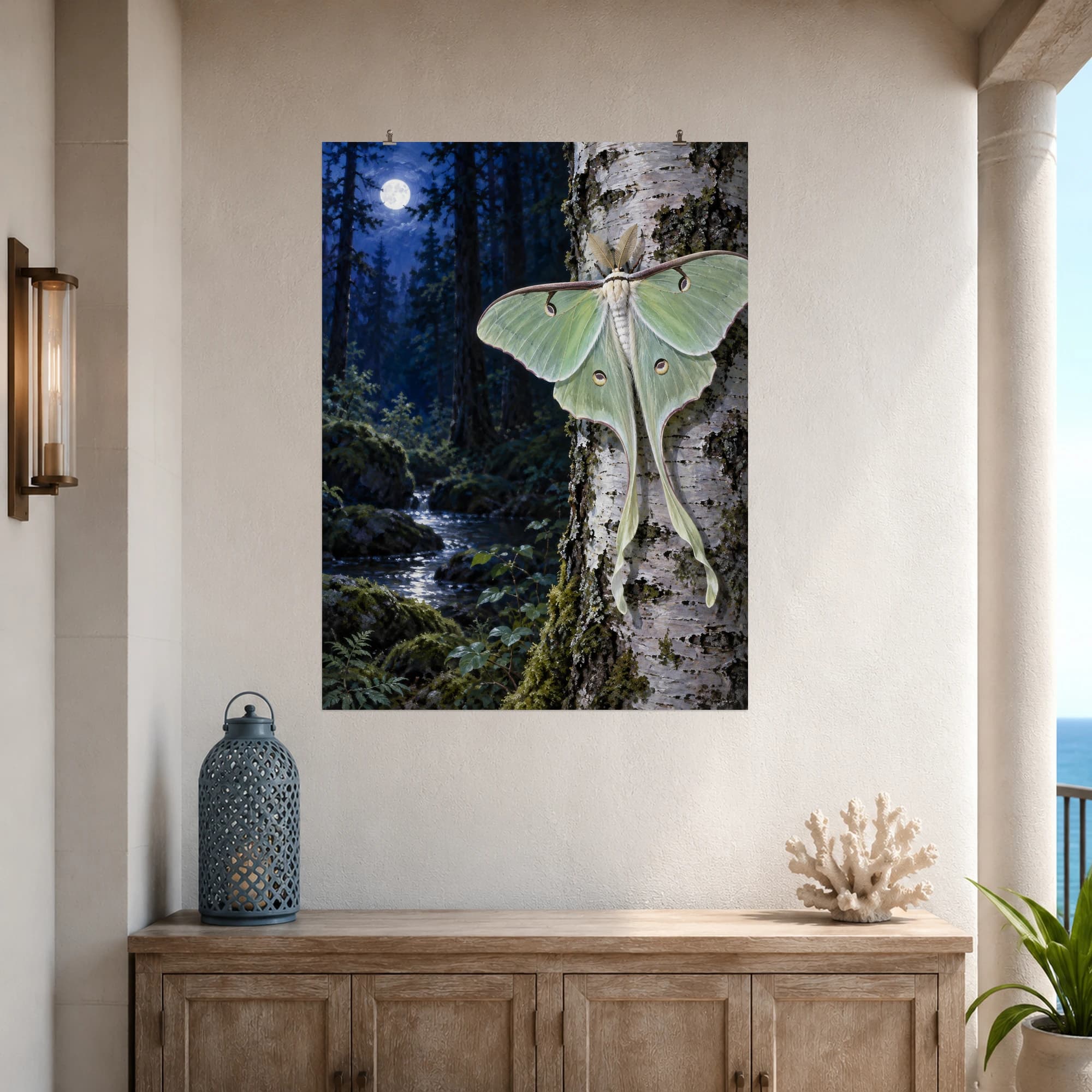 A pale green luna moth rests on silver birch bark in a quiet moonlit forest.