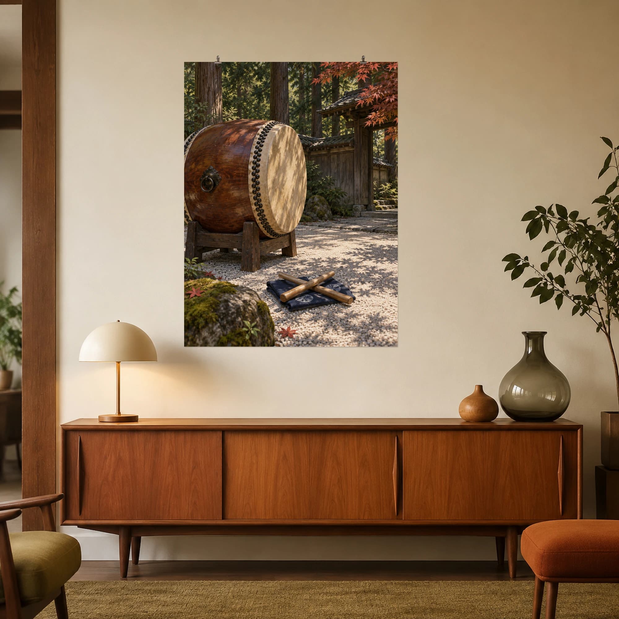 A taiko drum and wooden drumsticks rest in a quiet cedar courtyard beneath gentle maple shadows.