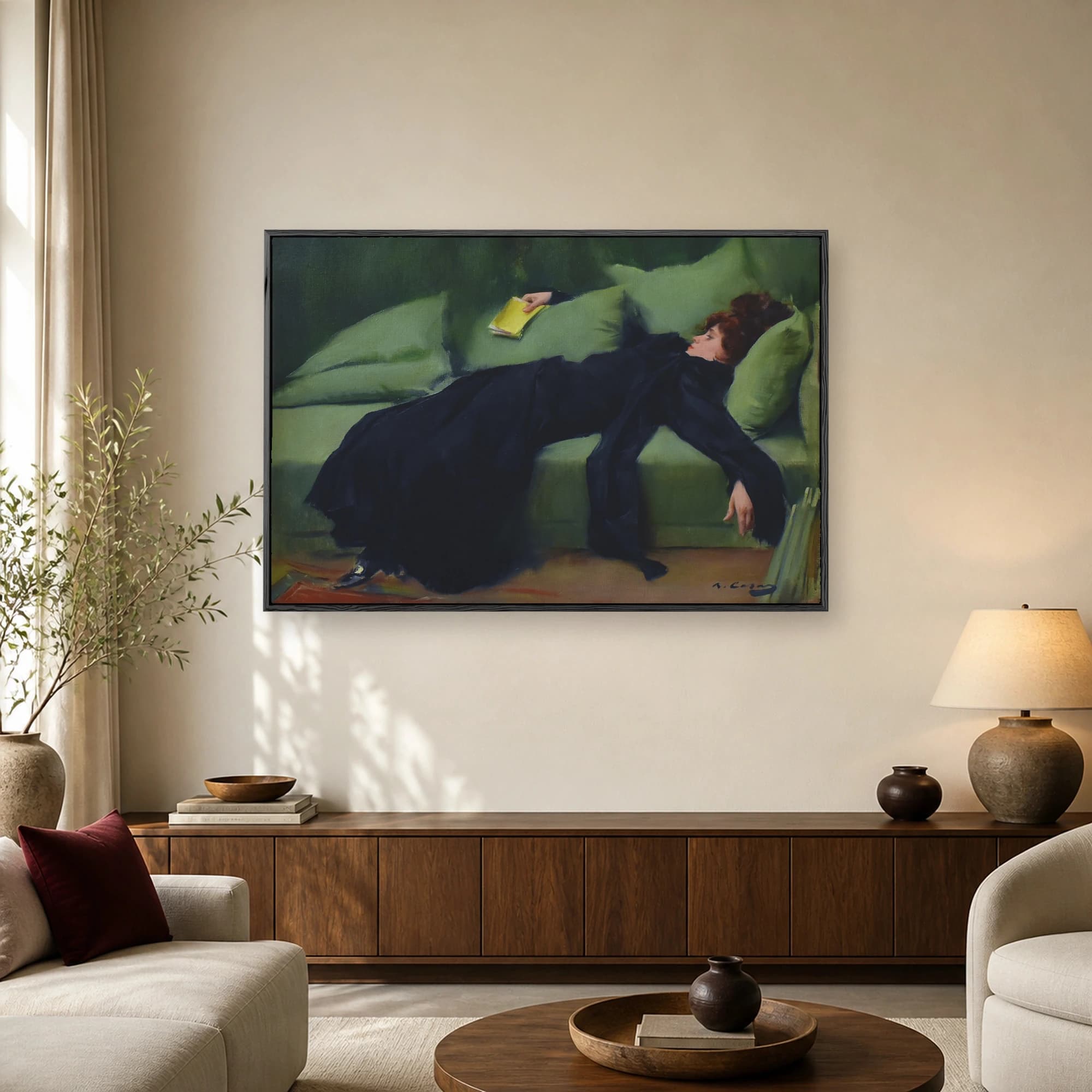 Fine art painting of a red-haired woman in a black dress resting on a green couch while holding a yellow book.