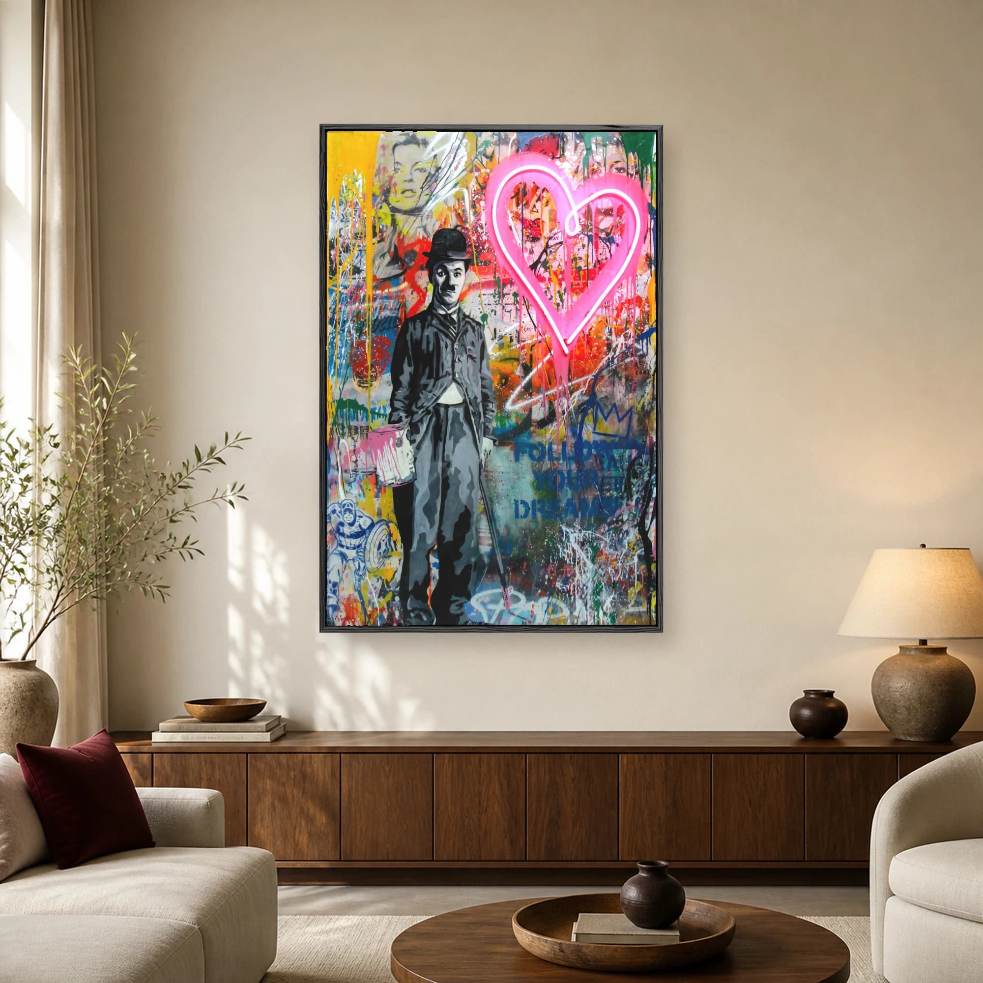 Urban street art canvas featuring a monochrome portrait of Charlie Chaplin next to a glowing pink neon heart and colorful paint drips.
