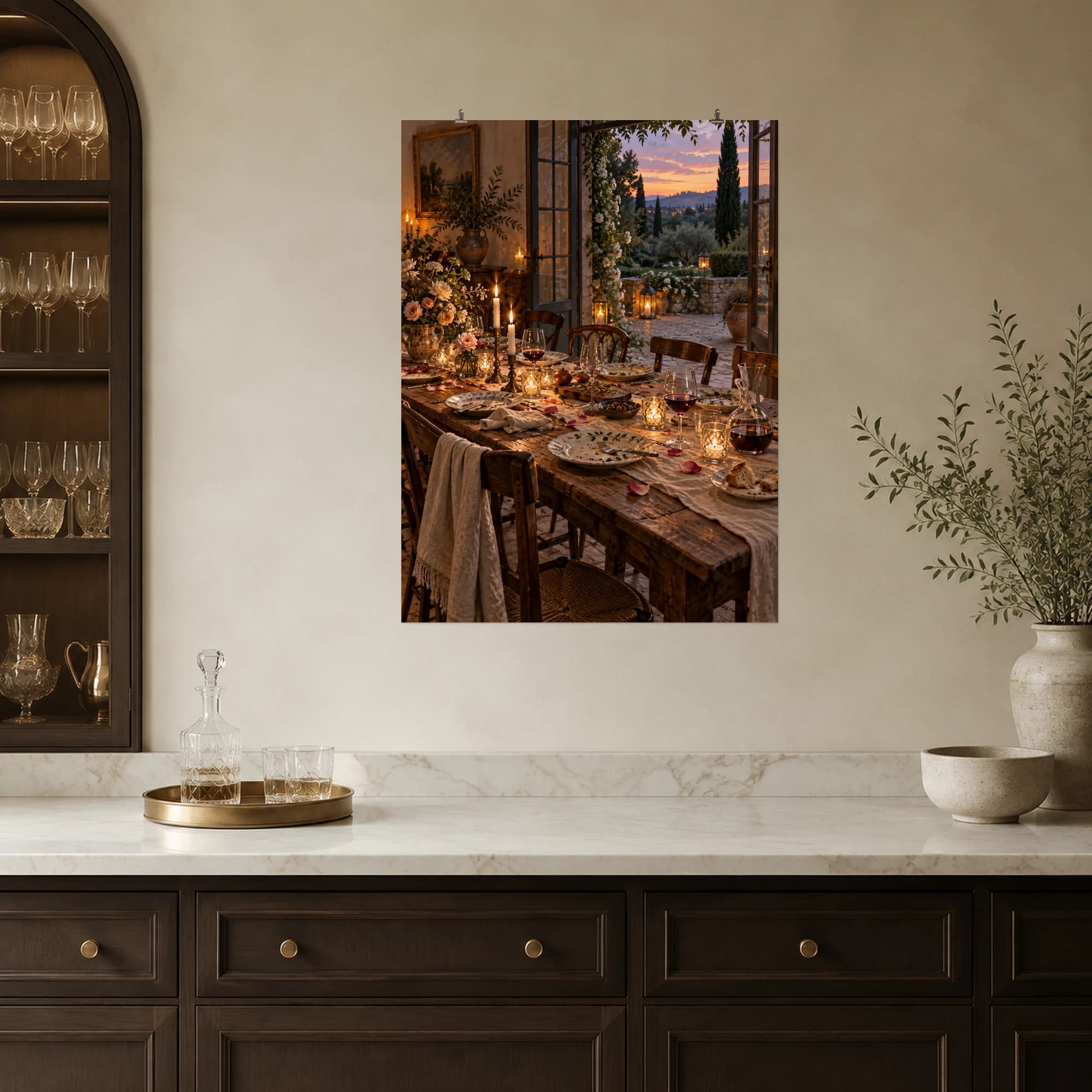 Candles and wine glasses linger on a dinner table as the garden settles into dusk.