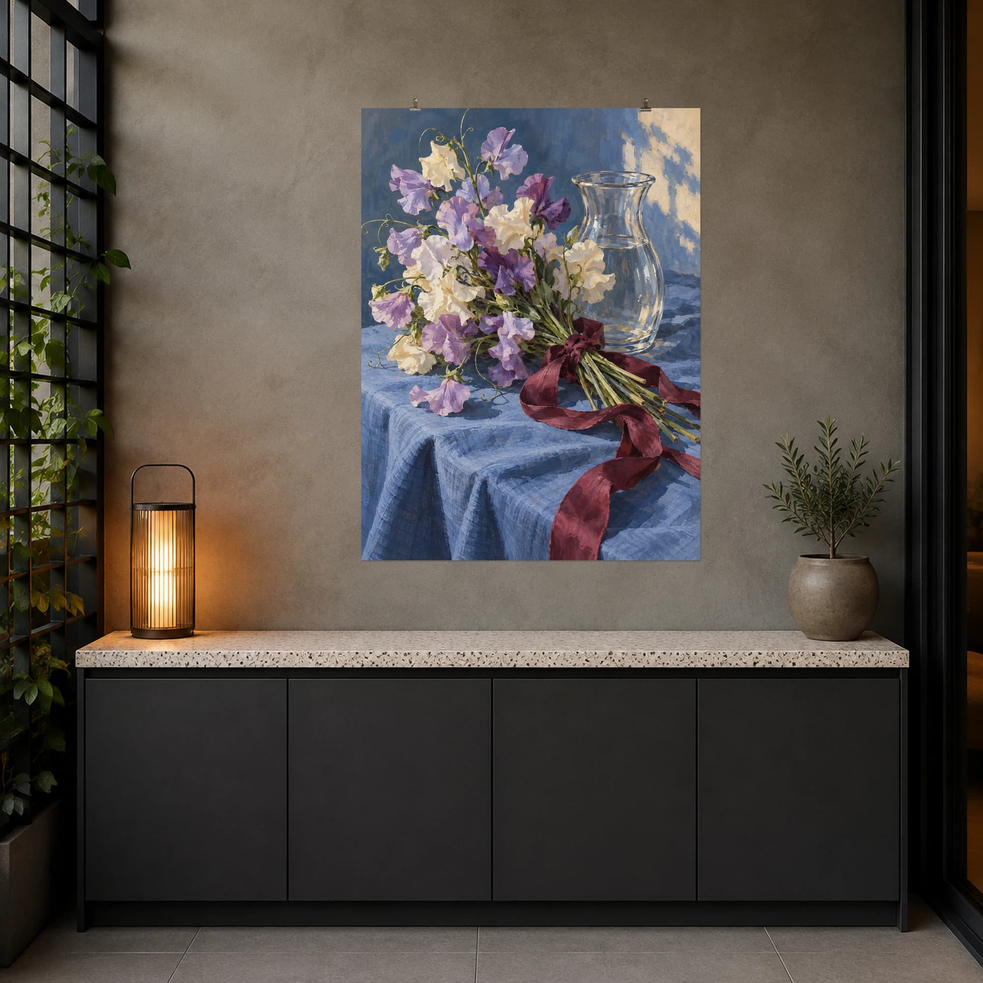 This gouache-style composition features lilac and cream sweet peas tied loosely with a wine ribbon beside a clear vase on blue linen. Expressive brushwork and carefully balanced color bring a distinctive focal point to your wall.