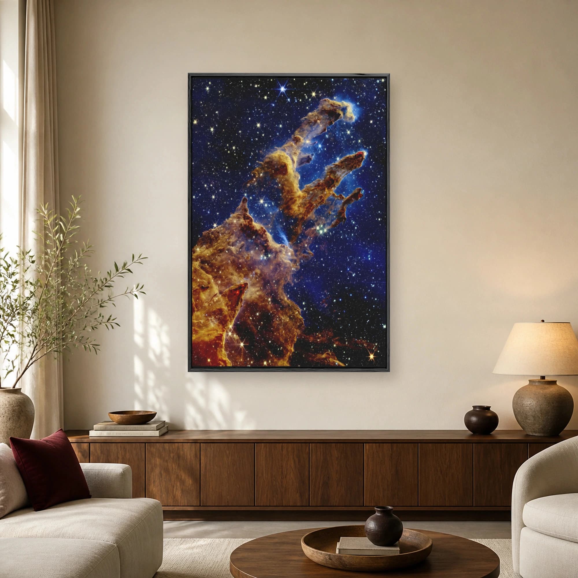 Stunning astrophotography print of the Pillars of Creation showing towering gas and dust clouds against a deep blue starry sky.
