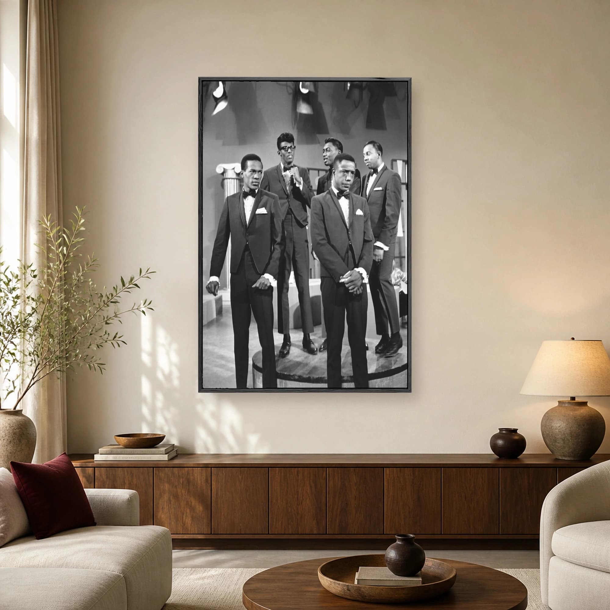 Black and white vintage photograph of five Motown singers in matching tuxedos posing on a 1960s television studio stage.