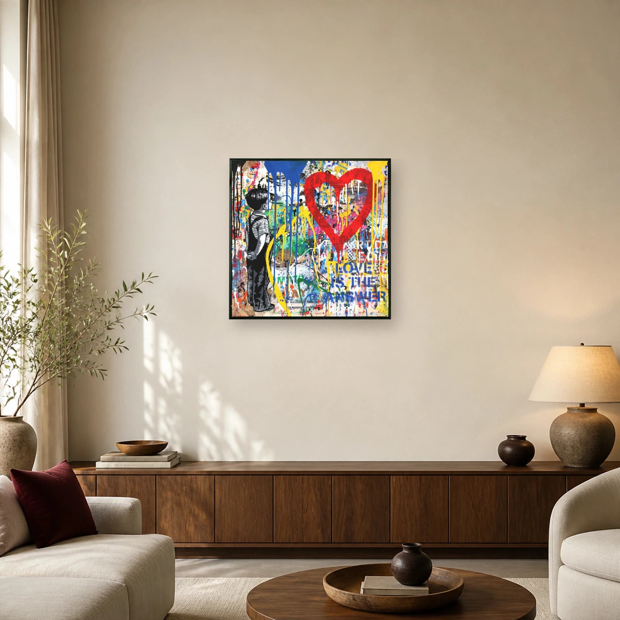 Street art print showing a monochrome boy looking at a large red heart with blue and yellow paint drips over a collage background.