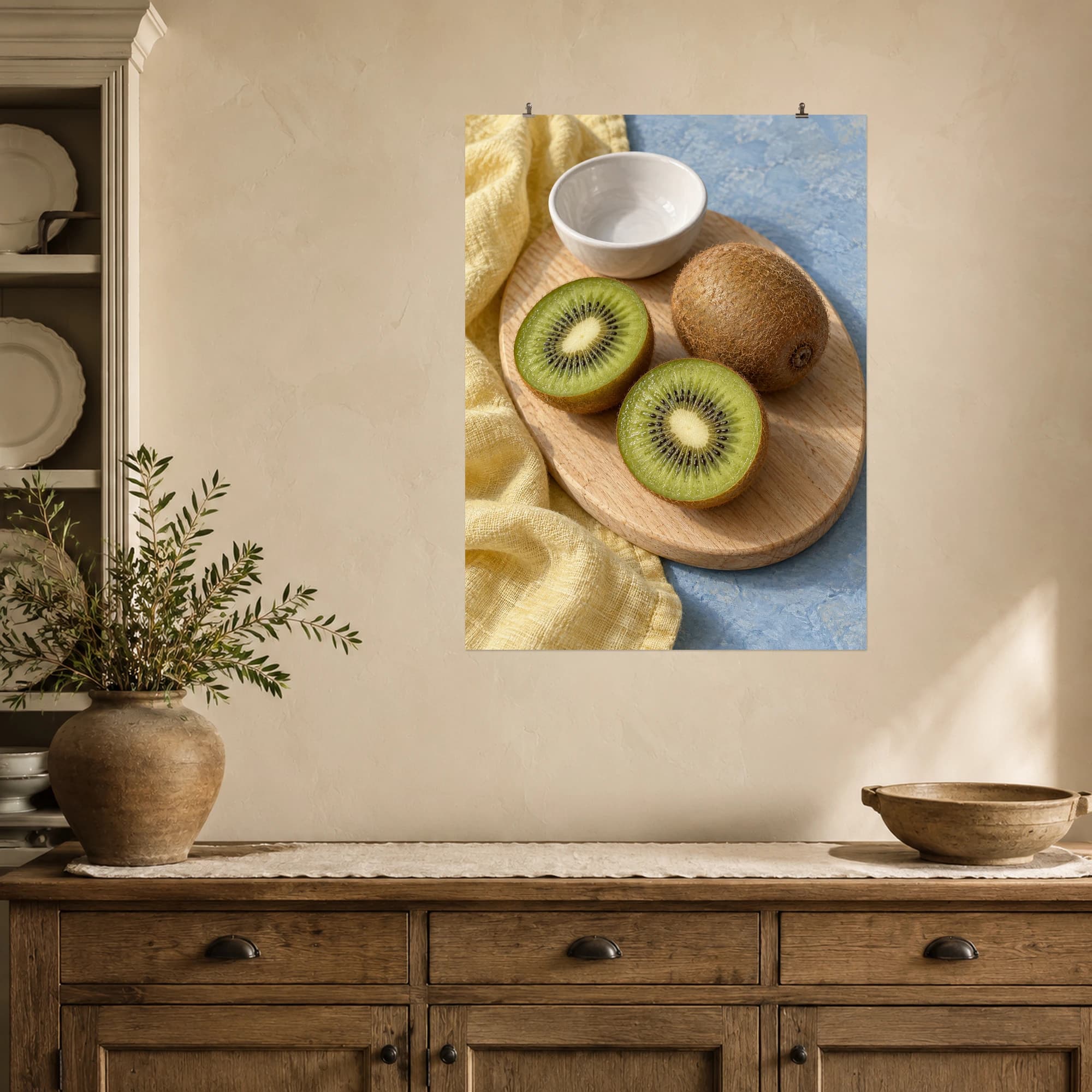 Cut kiwi fruit rests on a rustic wooden board beside a small white bowl.