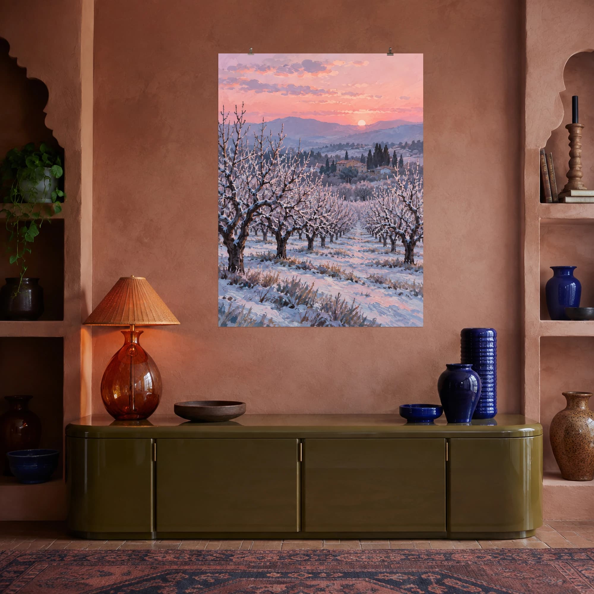 This gouache-style composition features rows of bare orchard trees dusted with frost beneath a pale rose winter dawn. Expressive brushwork and carefully balanced color bring a distinctive focal point to your wall.