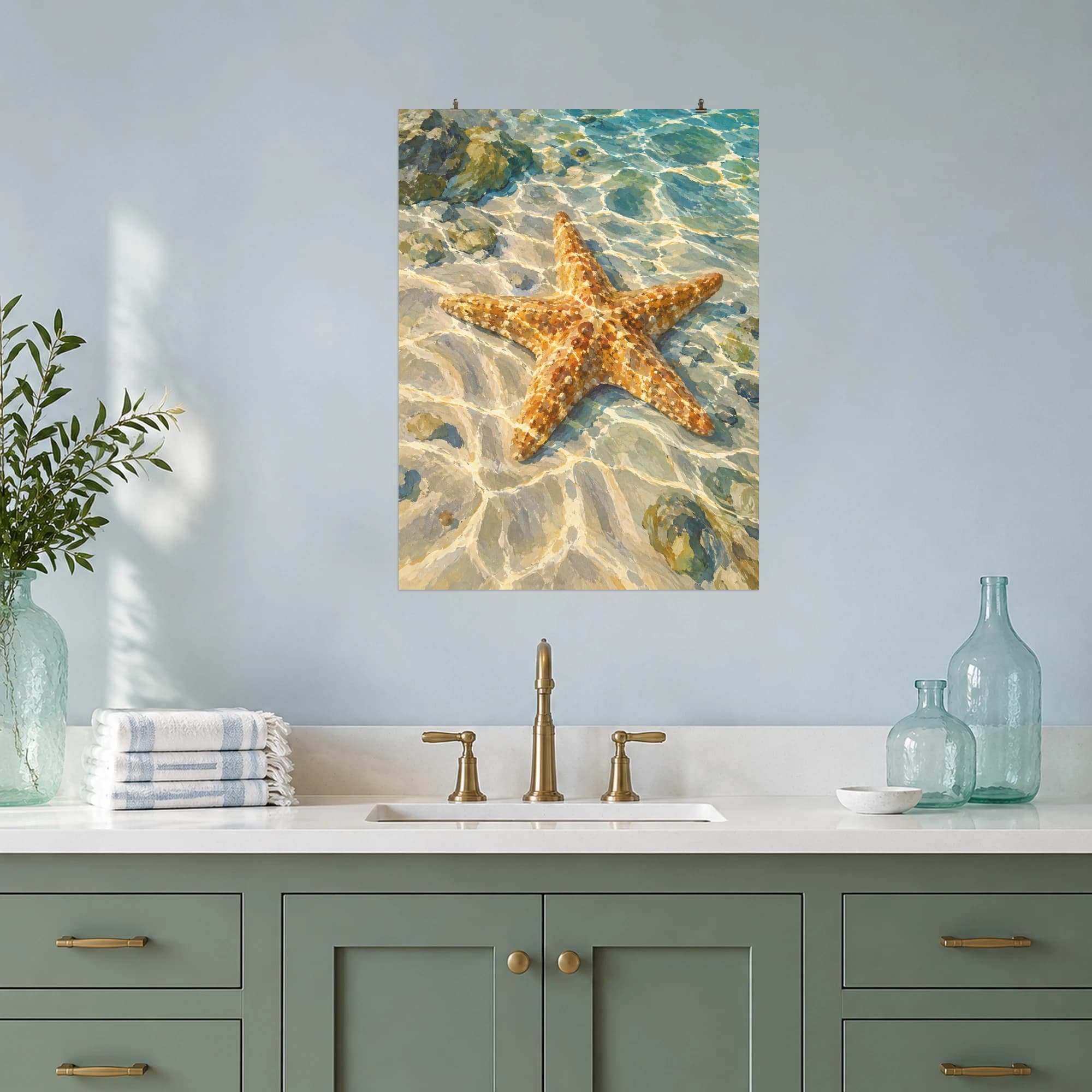 This gouache-style composition features a warm ochre starfish on rippled pale sand beneath transparent shallow water with dancing light. Expressive brushwork and carefully balanced color bring a distinctive focal point to your wall.