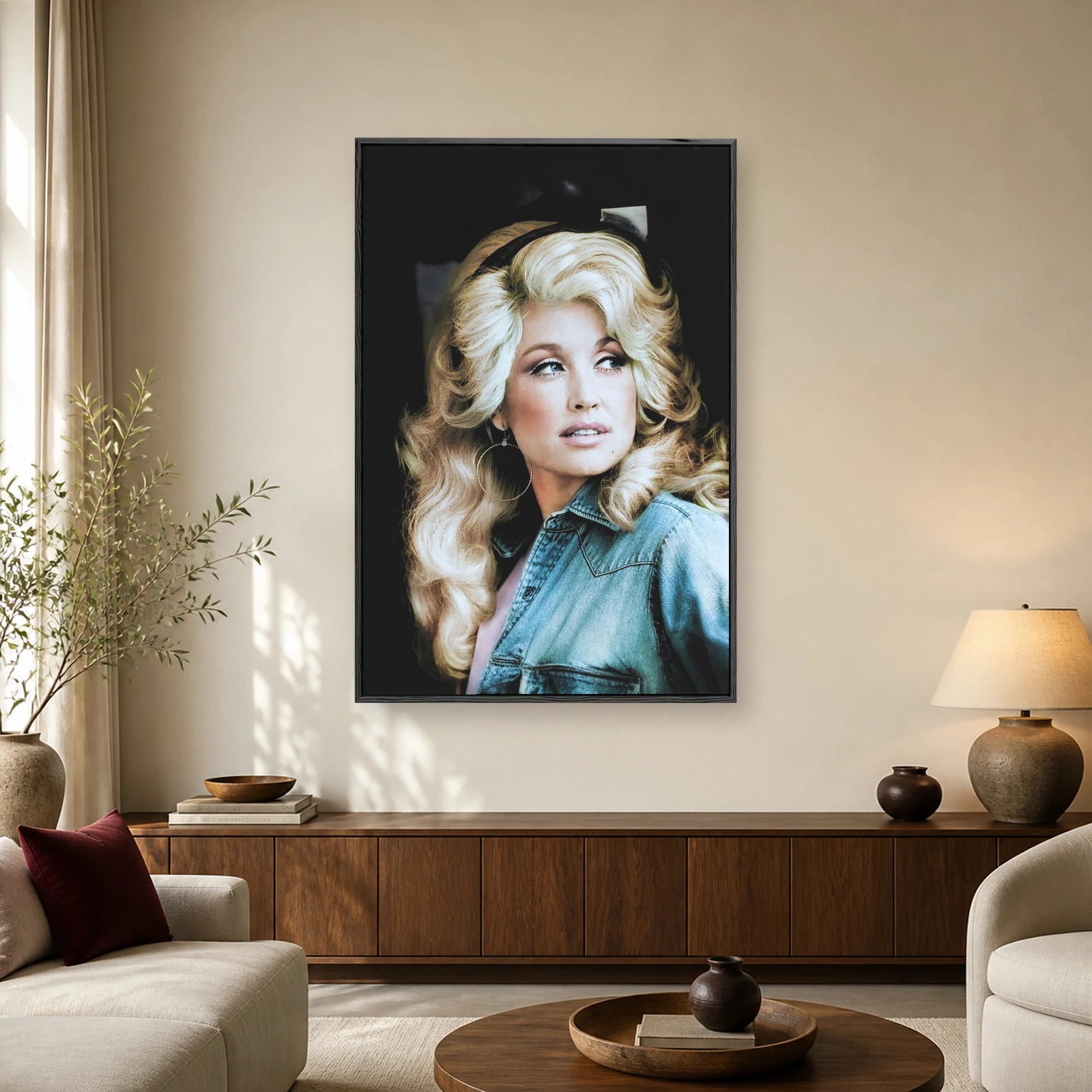 Vintage style photographic portrait of legendary singer Dolly Parton with voluminous blonde hair wearing a blue denim shirt and gold hoop earrings against a dark background