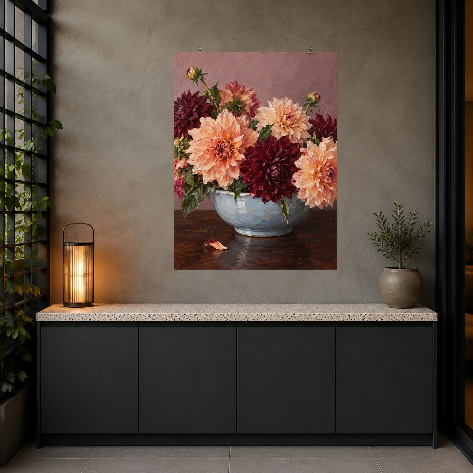 Peach and burgundy dahlias gather in a blue bowl beneath gentle evening light.