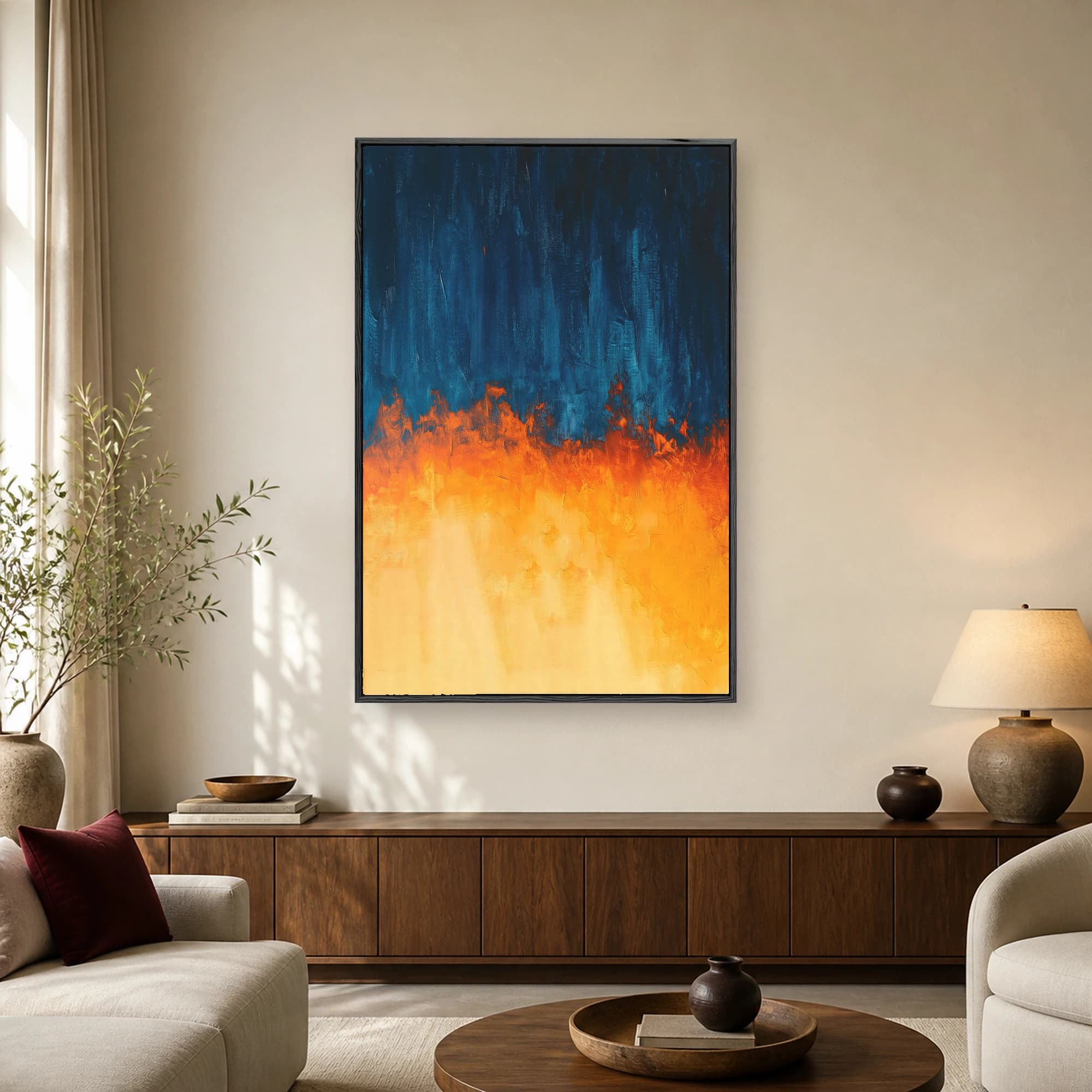 Abstract painting featuring deep navy blue textured strokes at the top meeting blazing orange and yellow brushwork at the bottom.