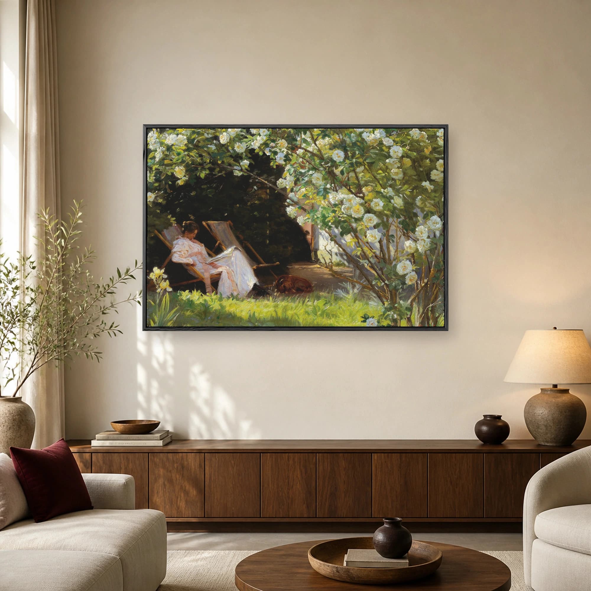 Impressionist painting of a woman in a white dress reading a book under a blooming white rose bush with a sleeping dog on the grass.