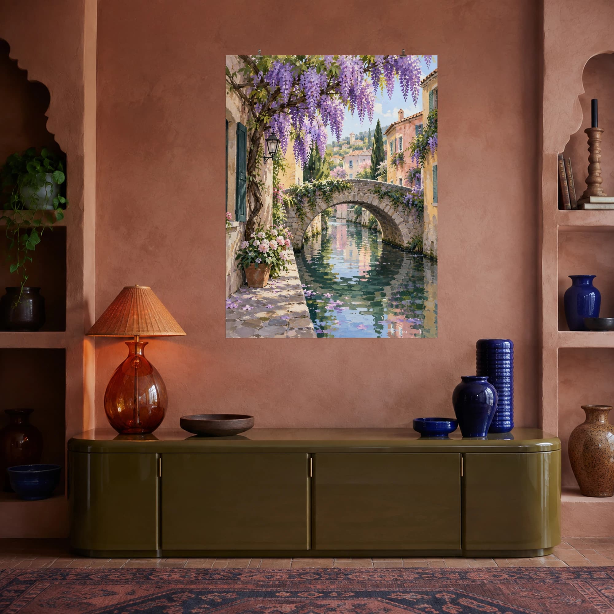 This gouache-style composition features an intimate stone footbridge crossing a narrow canal beneath cascading lavender wisteria, reflected pastel houses and soft spring light. Expressive brushwork and a balanced palette bring warmth and character to your space.