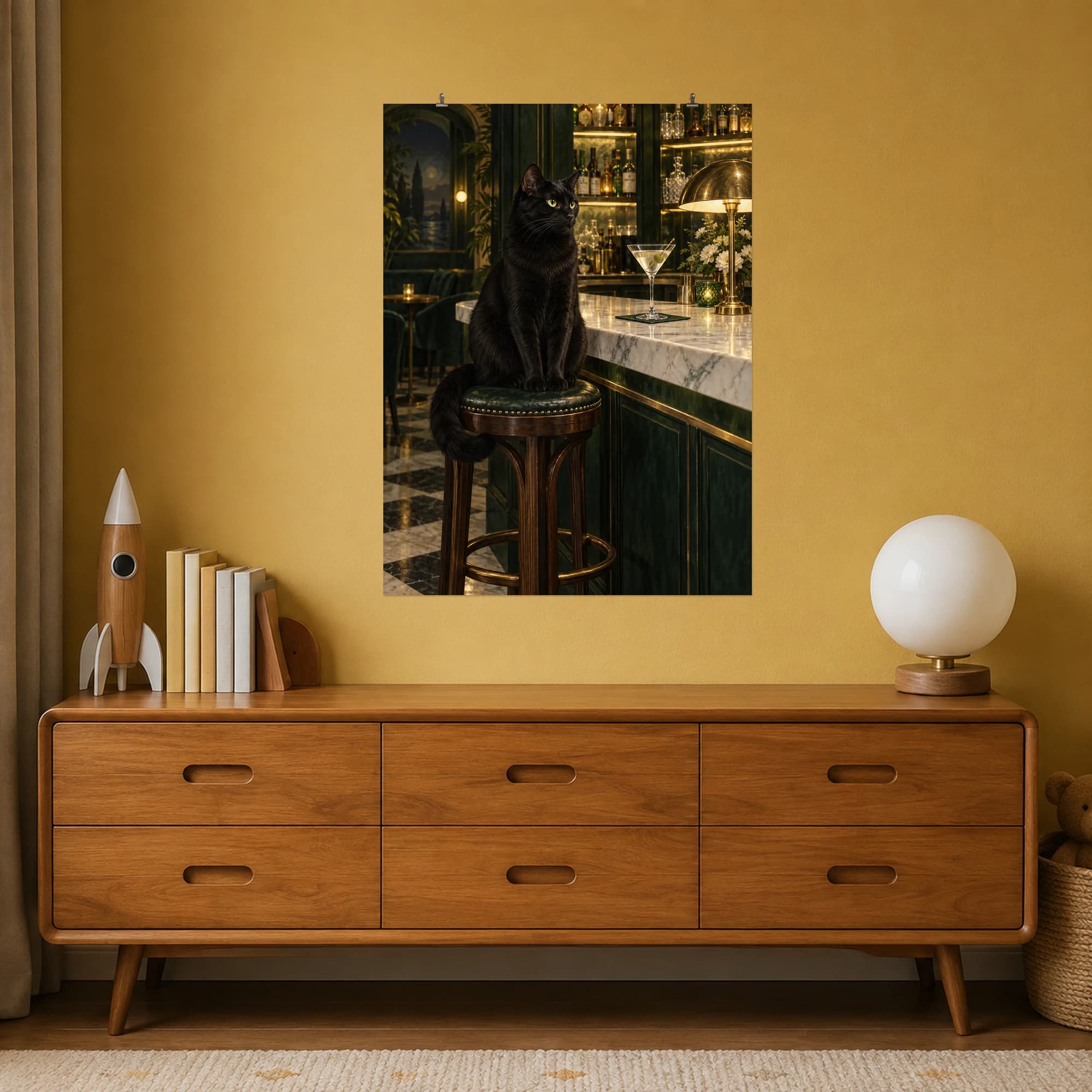 A black cat watches over an elegant marble bar beside a single martini glass.