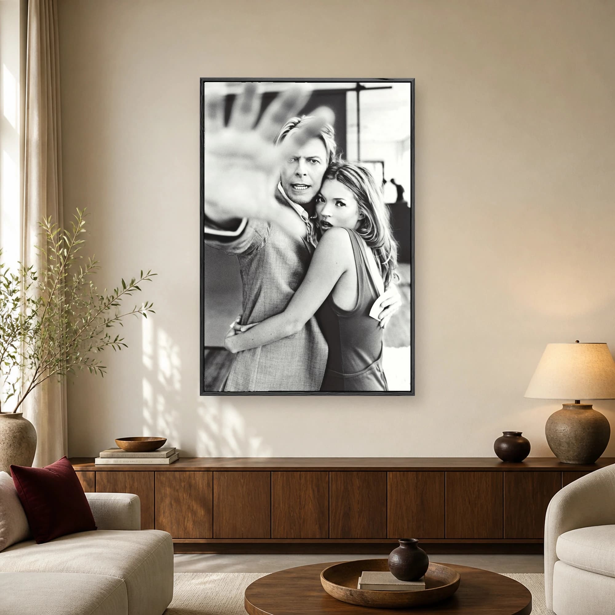 Black and white portrait art print featuring David Bowie and Kate Moss embracing in a dynamic studio shoot.