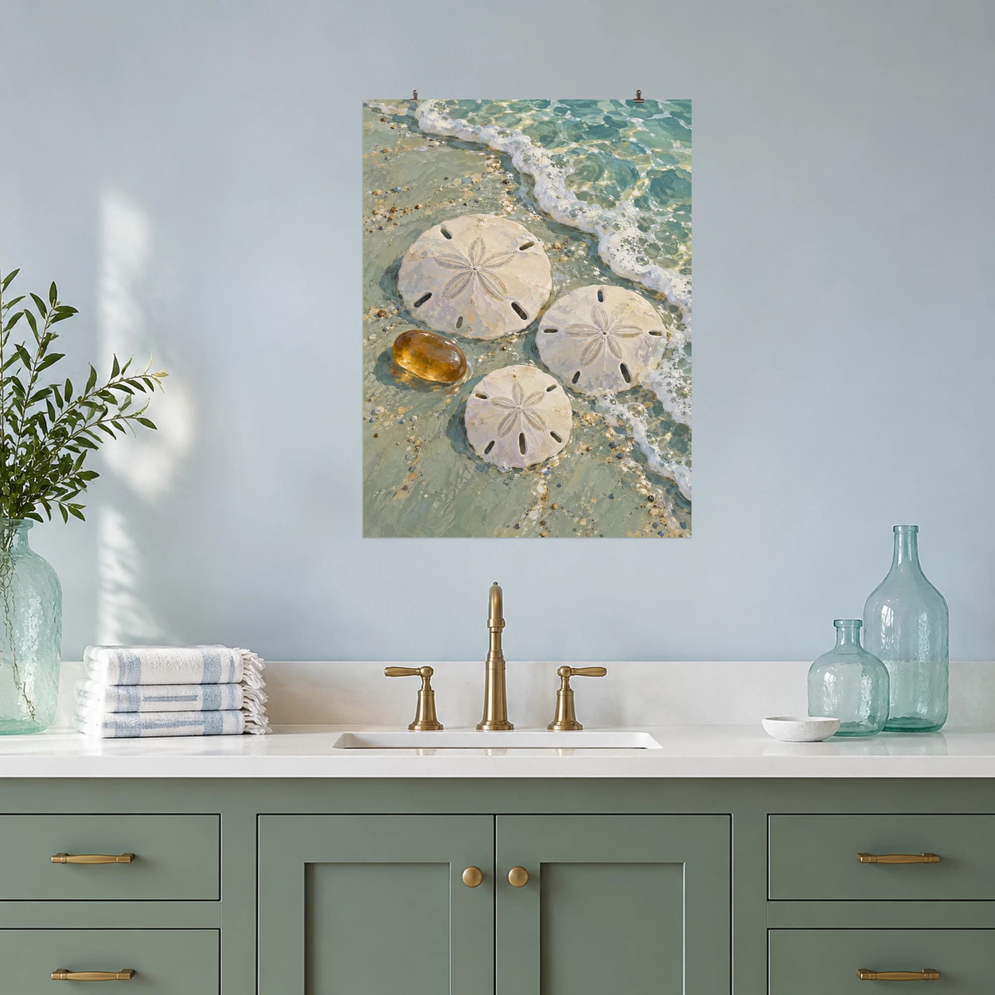 This gouache-style composition features three delicate pale sand dollars arranged with one smooth amber pebble on wet seafoam colored sand, a curving tide line and translucent water. Expressive brushwork and a balanced palette bring warmth and character to your space.