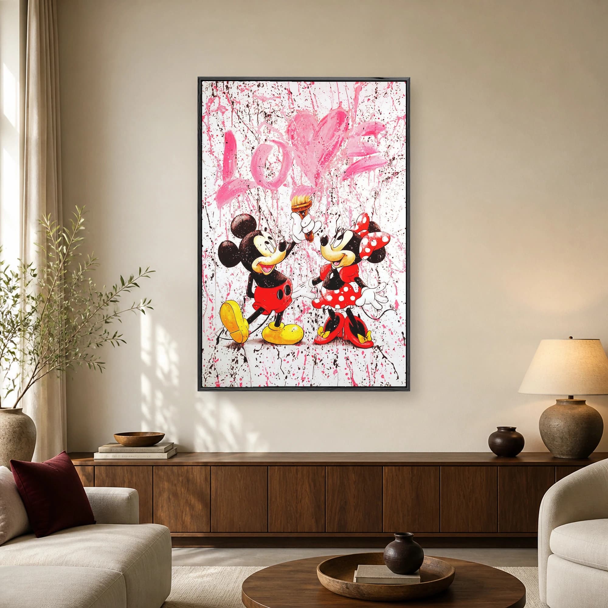 Pop art painting of Mickey and Minnie Mouse painting a giant pink heart and the word LOVE with paint splatters on a white background