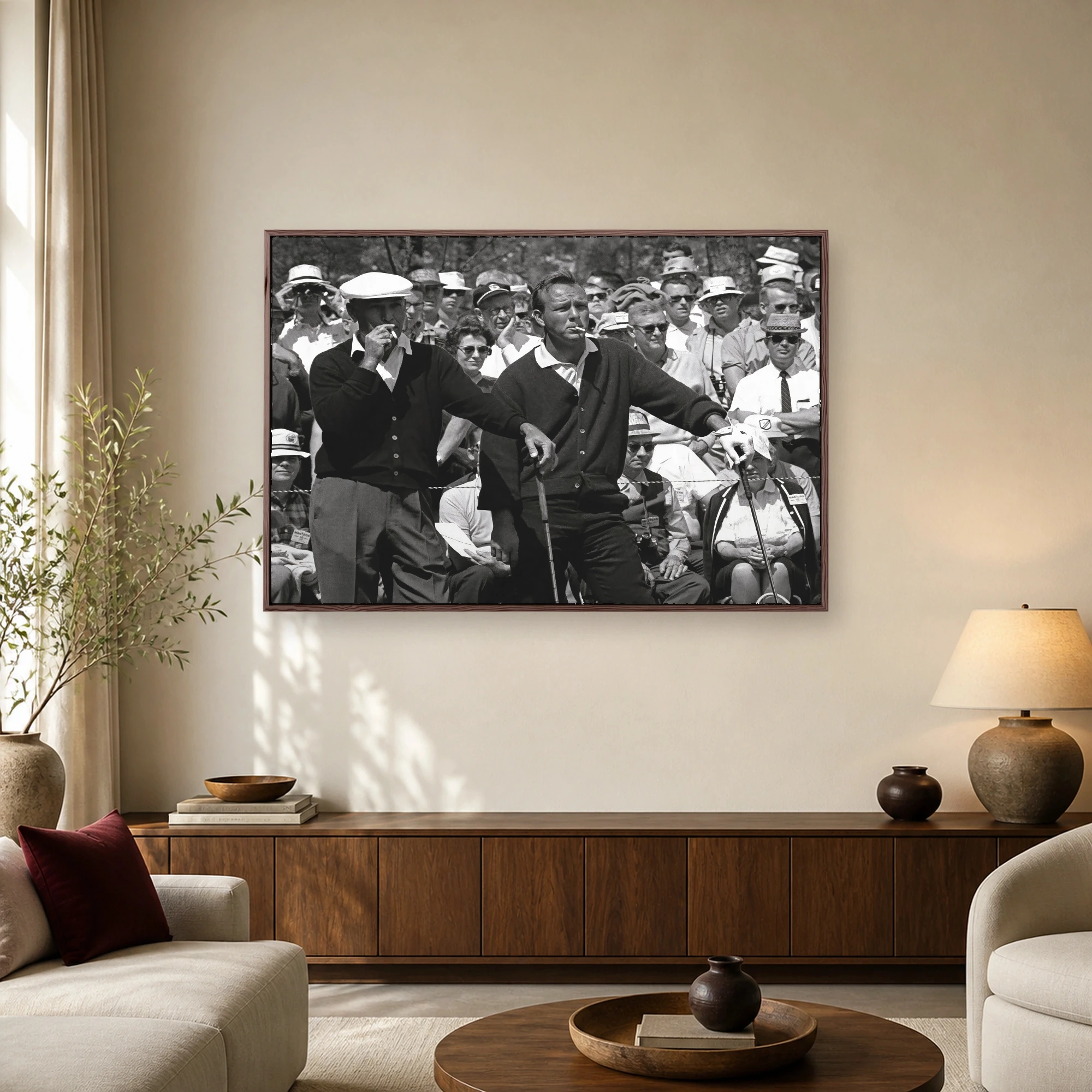 Black and white vintage photograph showing golf legends Arnold Palmer and Ben Hogan smoking cigarettes on the tee box surrounded by spectators.