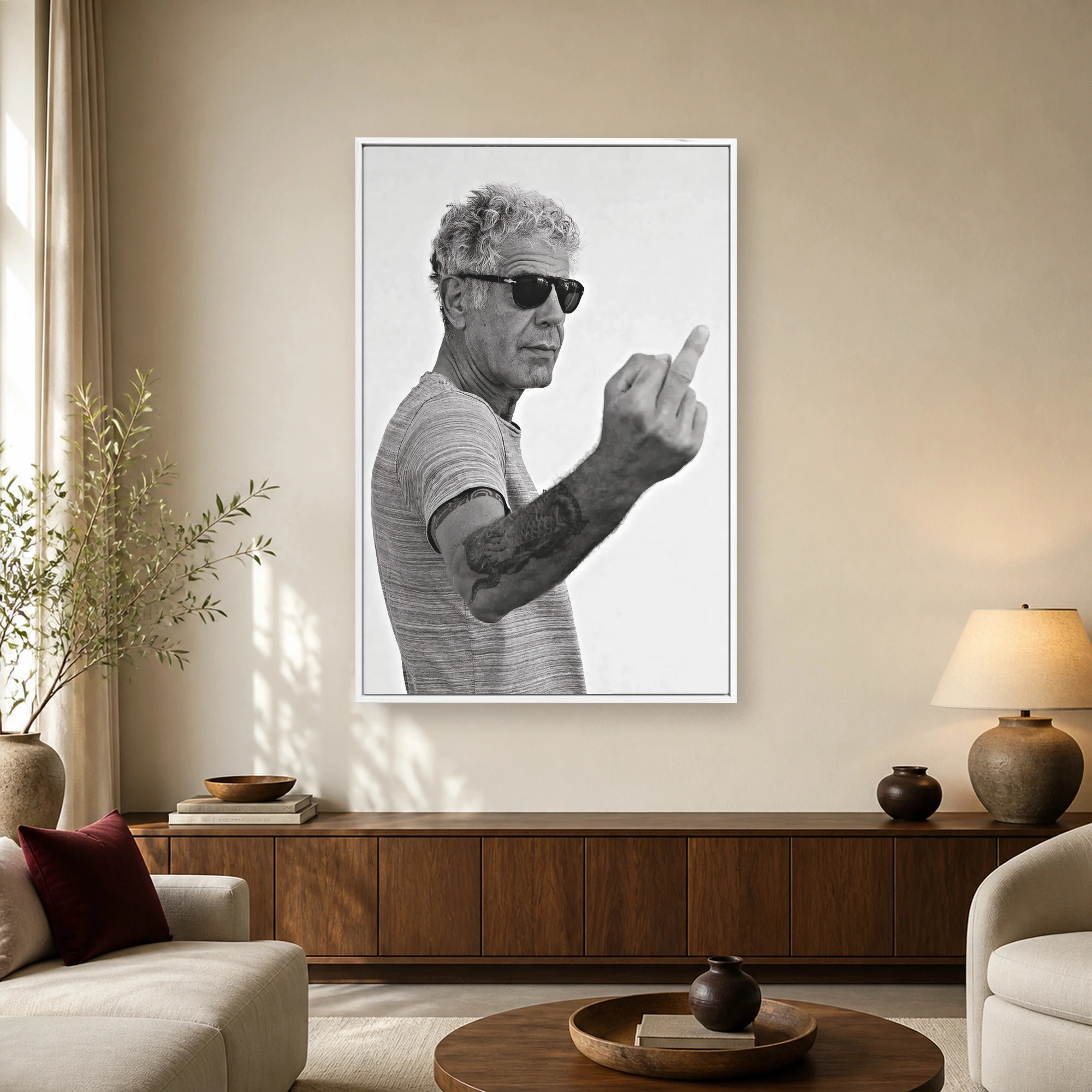 Detailed black and white portrait of Anthony Bourdain wearing sunglasses and gesturing with his middle finger.