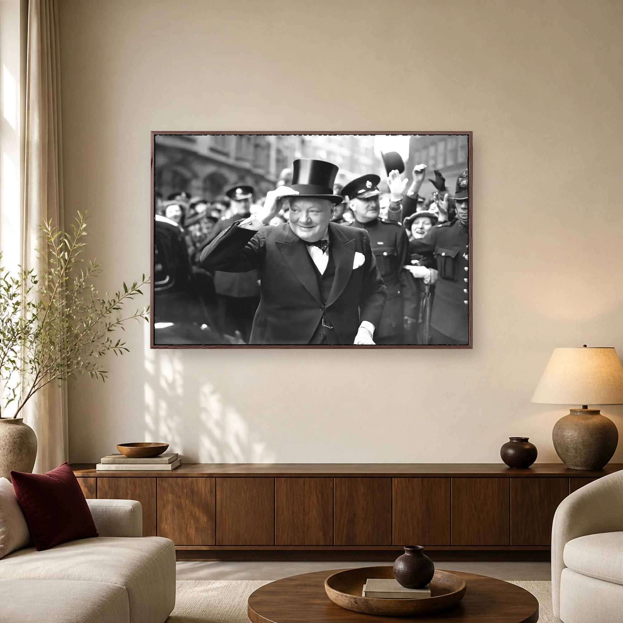 Historic black and white photograph of Winston Churchill smiling and tipping his top hat while surrounded by a cheering crowd and British police officers.
