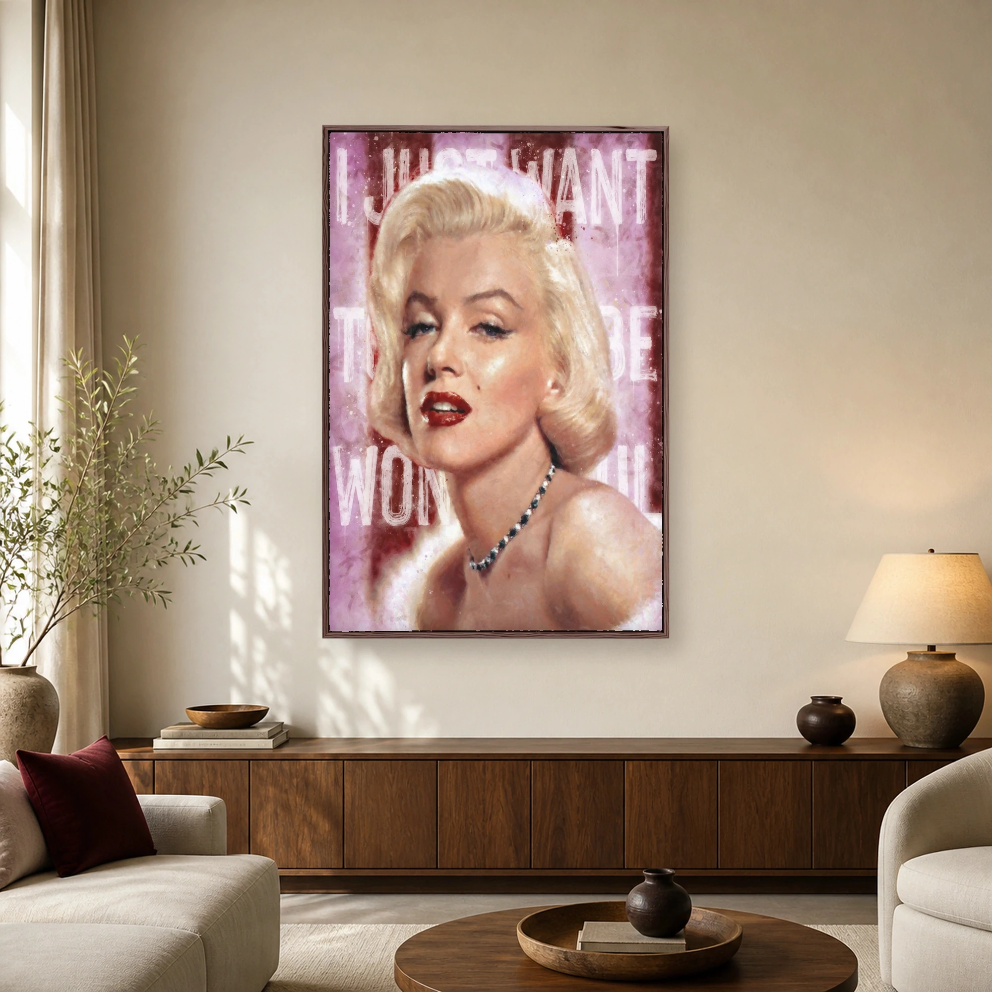 Marilyn Monroe portrait wall art featuring blonde hair, red lips, gemstone necklace, and stenciled text over a pink and burgundy background.